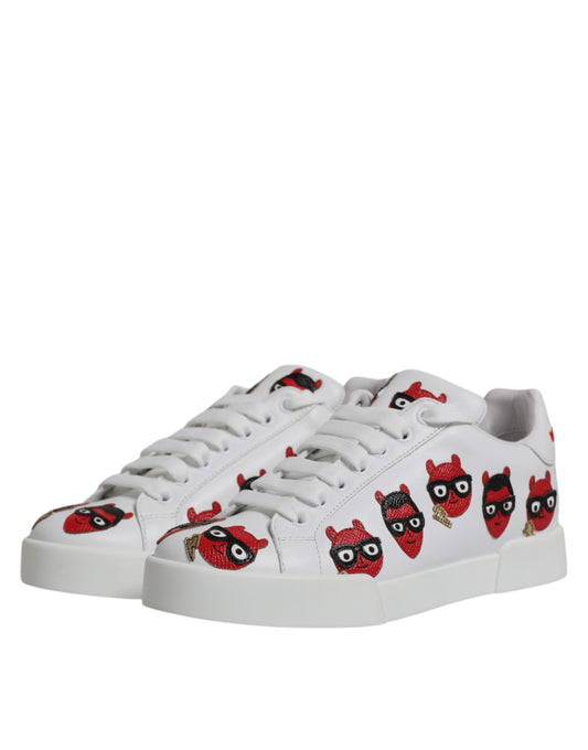 White sneakers with red and black cartoon character designs on side panels