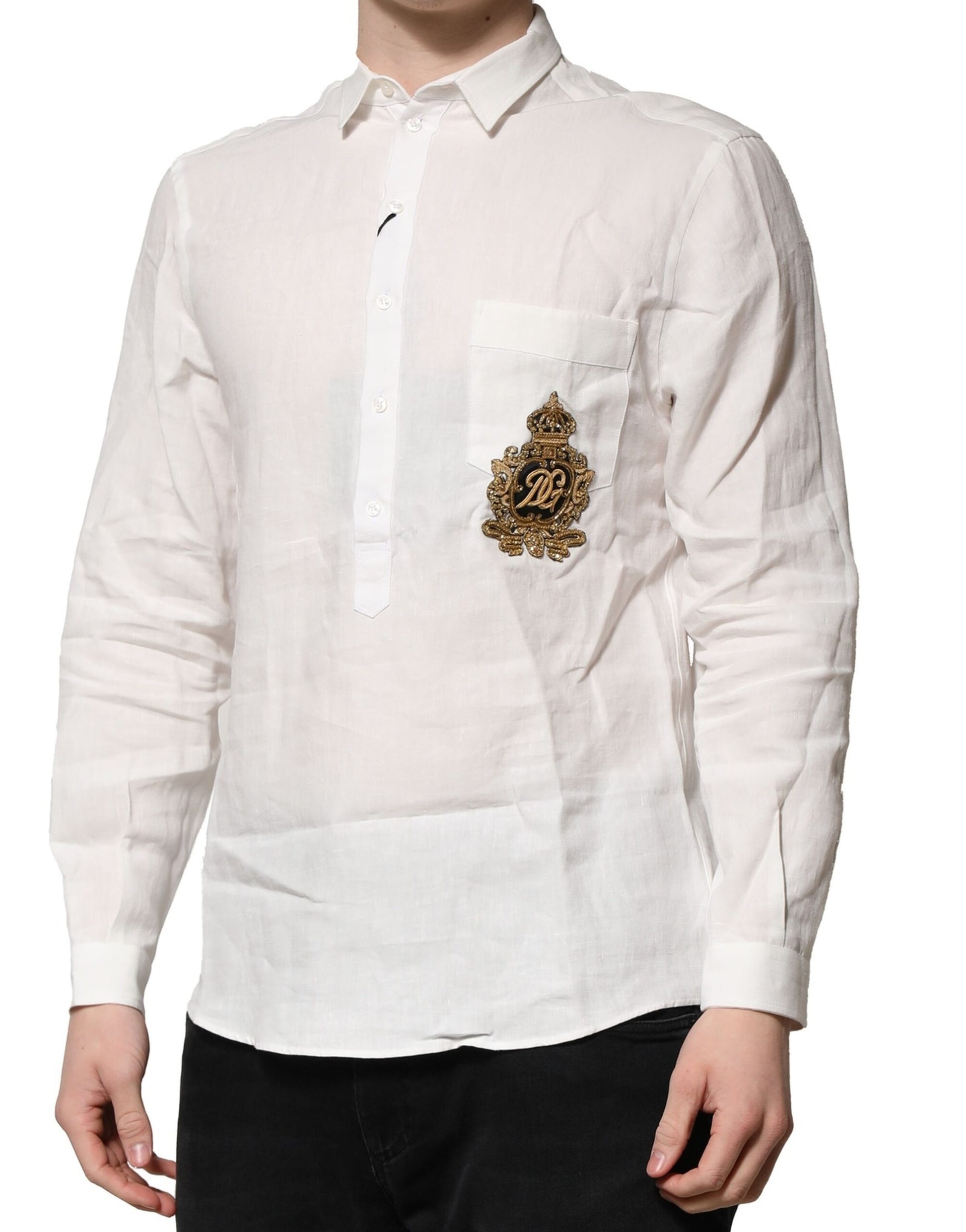A long-sleeved white shirt with a gold crown embellishment on the left chest