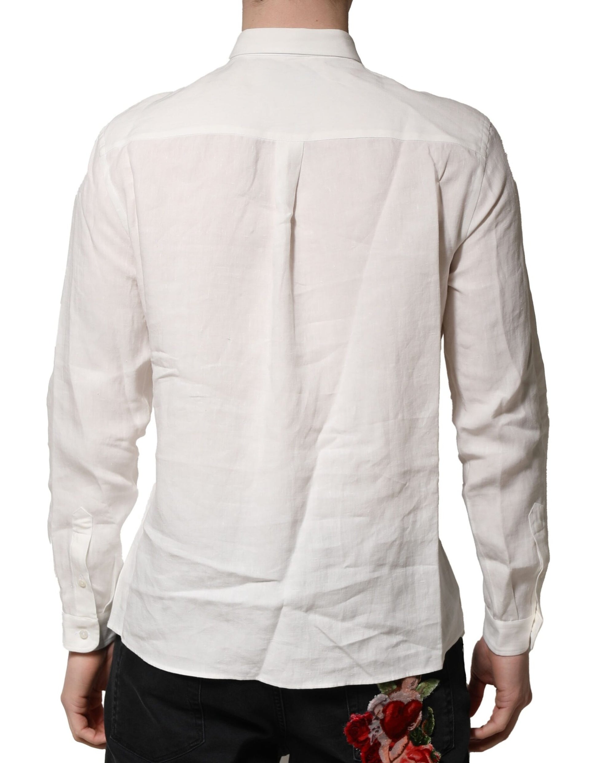 A white dress shirt with a floral embellishment on the back