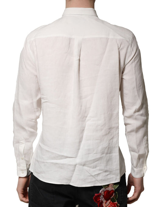 A white dress shirt with a floral embellishment on the back