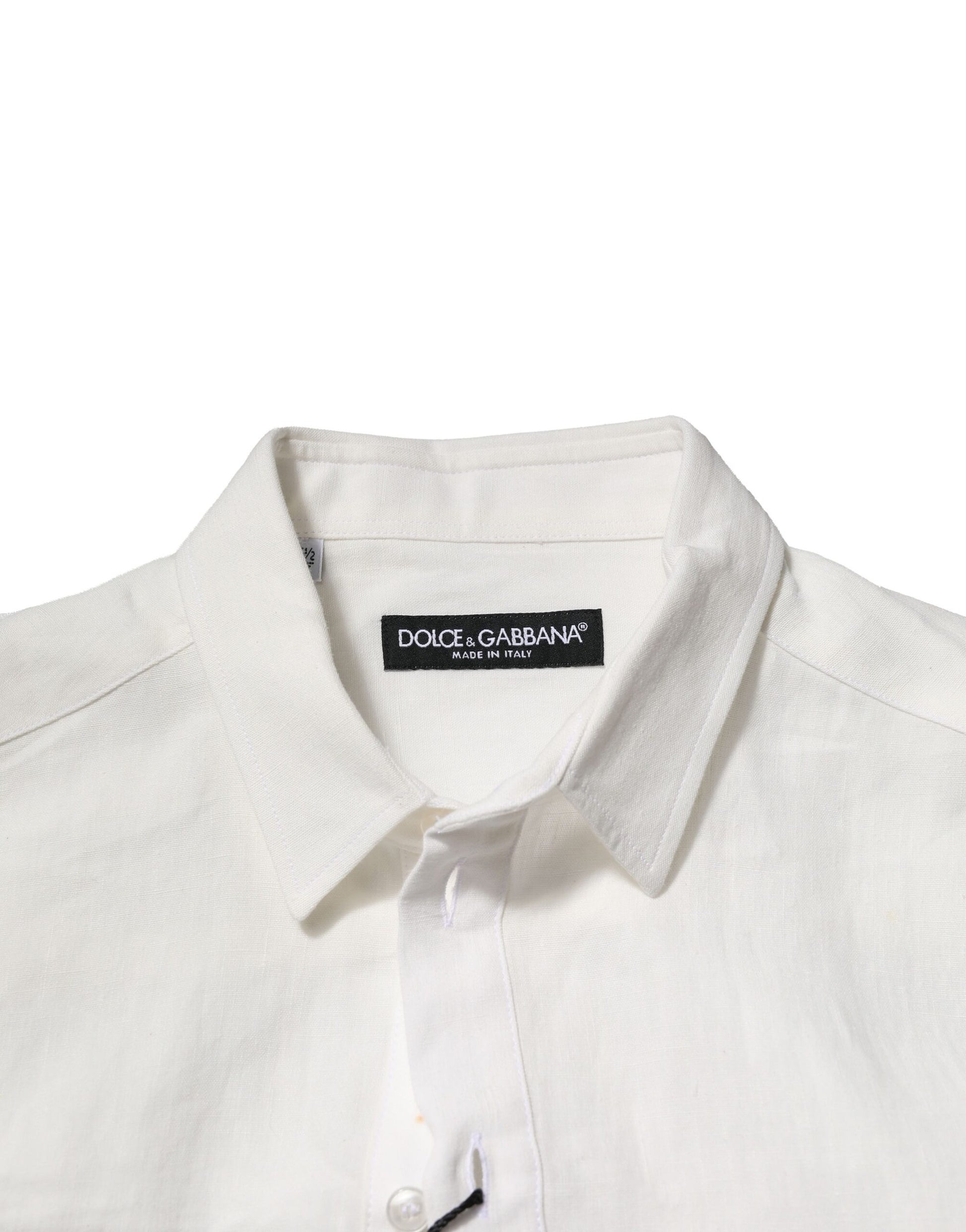 A white formal shirt with a crown embellishment on the left chest, from the brand Dolce & Gabbana