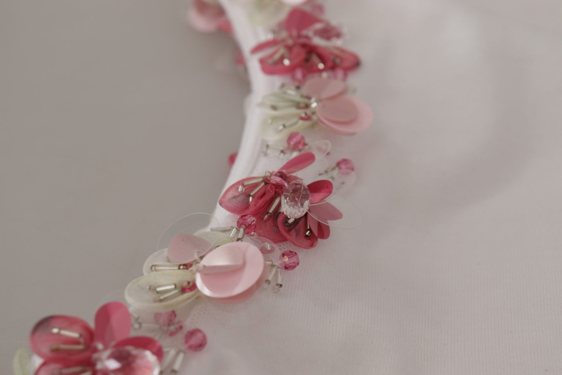 Decorative fabric with pink and red beads