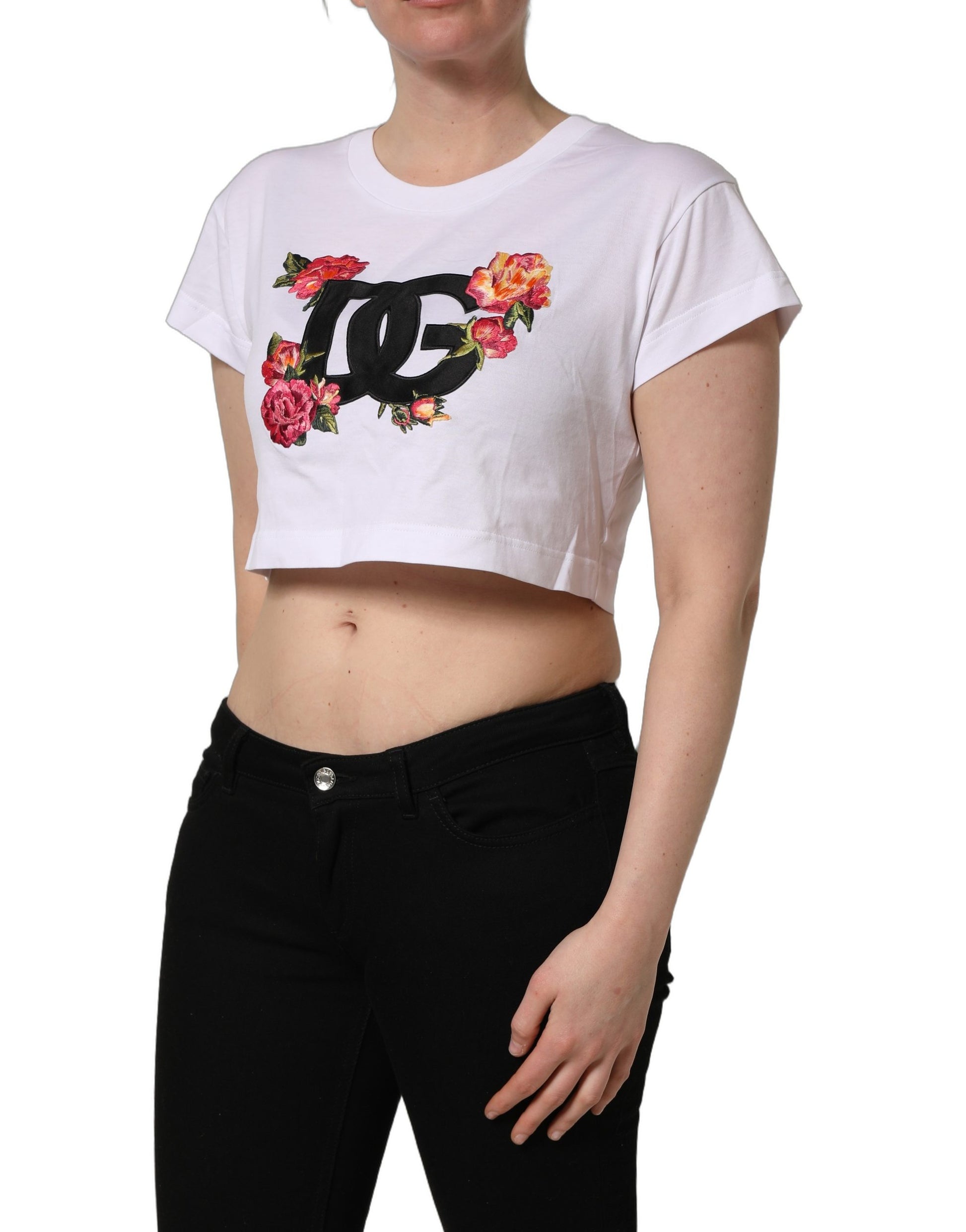 A white crop top with a floral design on the front, featuring the Dolce & Gabbana logo