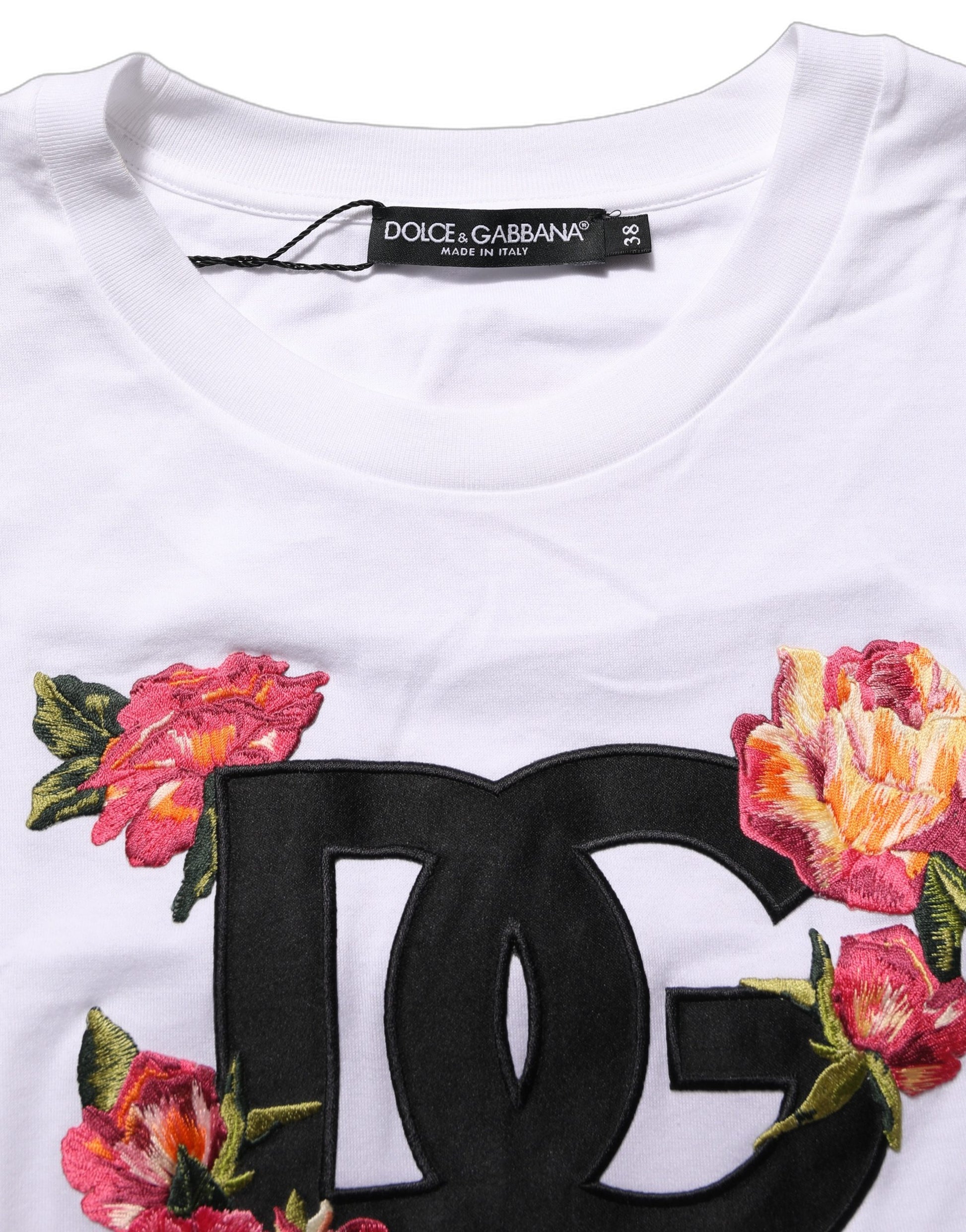 A white crop t-shirt with a floral pattern and the Dolce & Gabbana logo