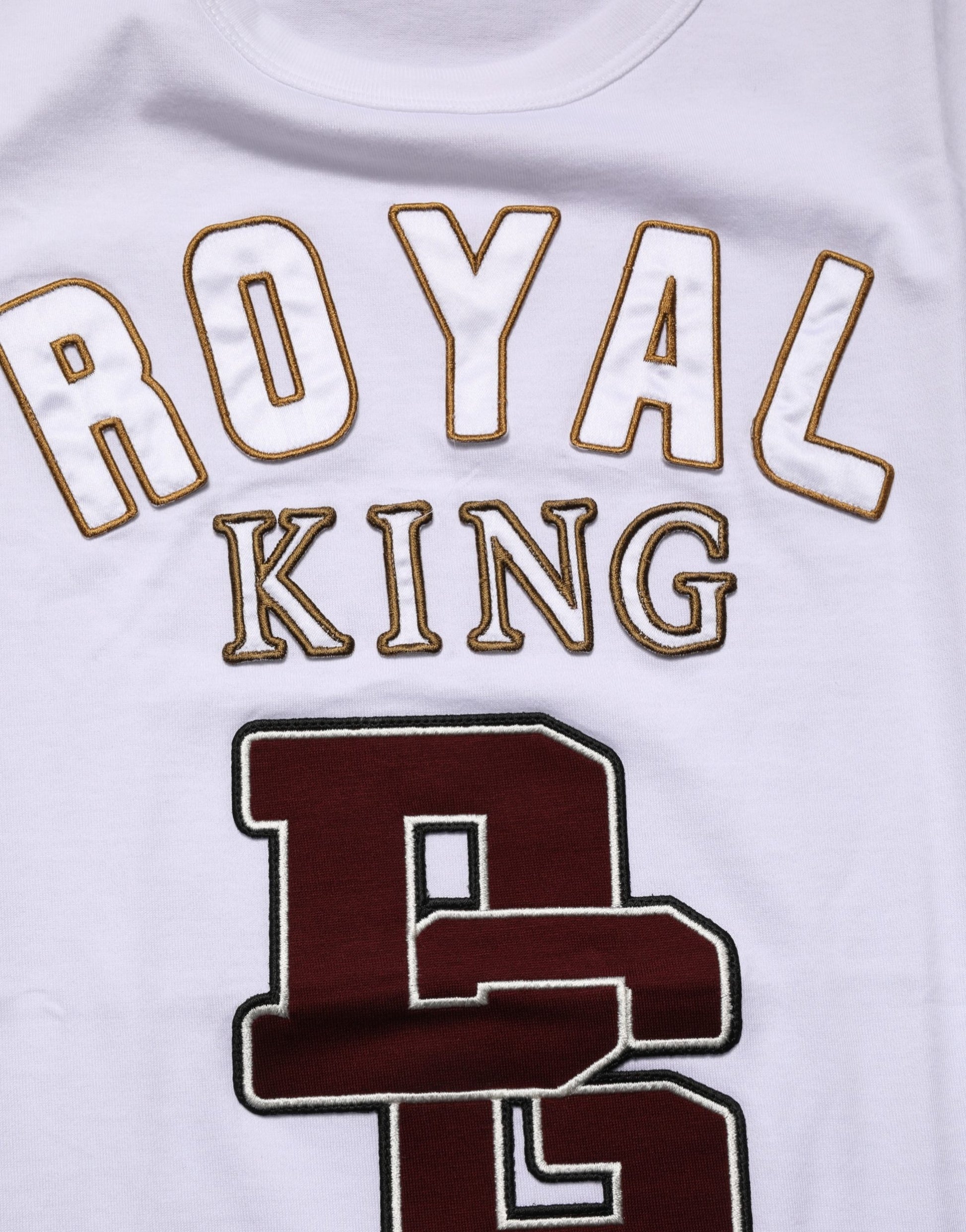 White jersey with royal king printed on front