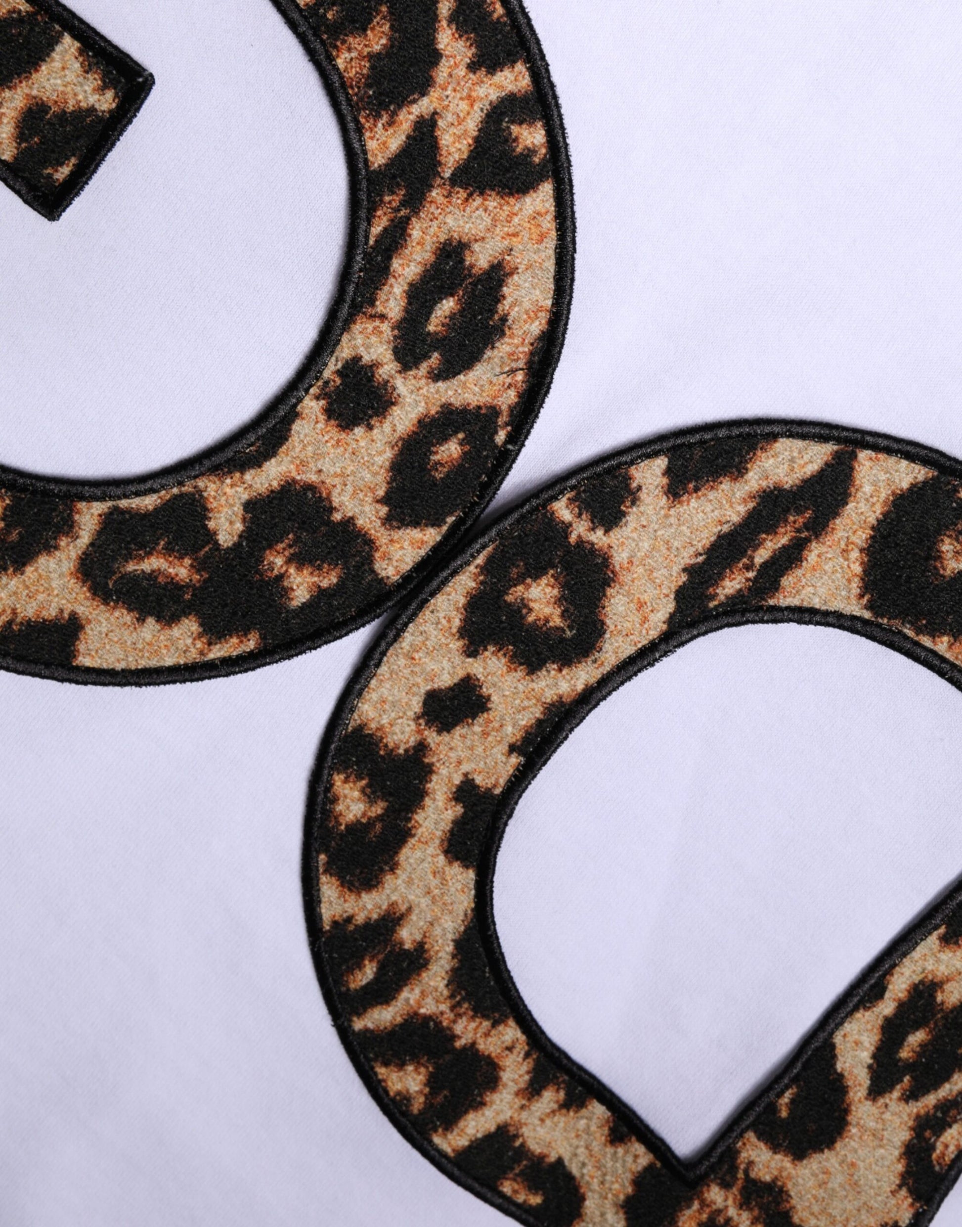 Leopard print letter patches on white fabric