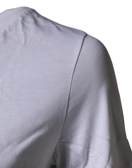 The back of a person wearing a light gray shirt