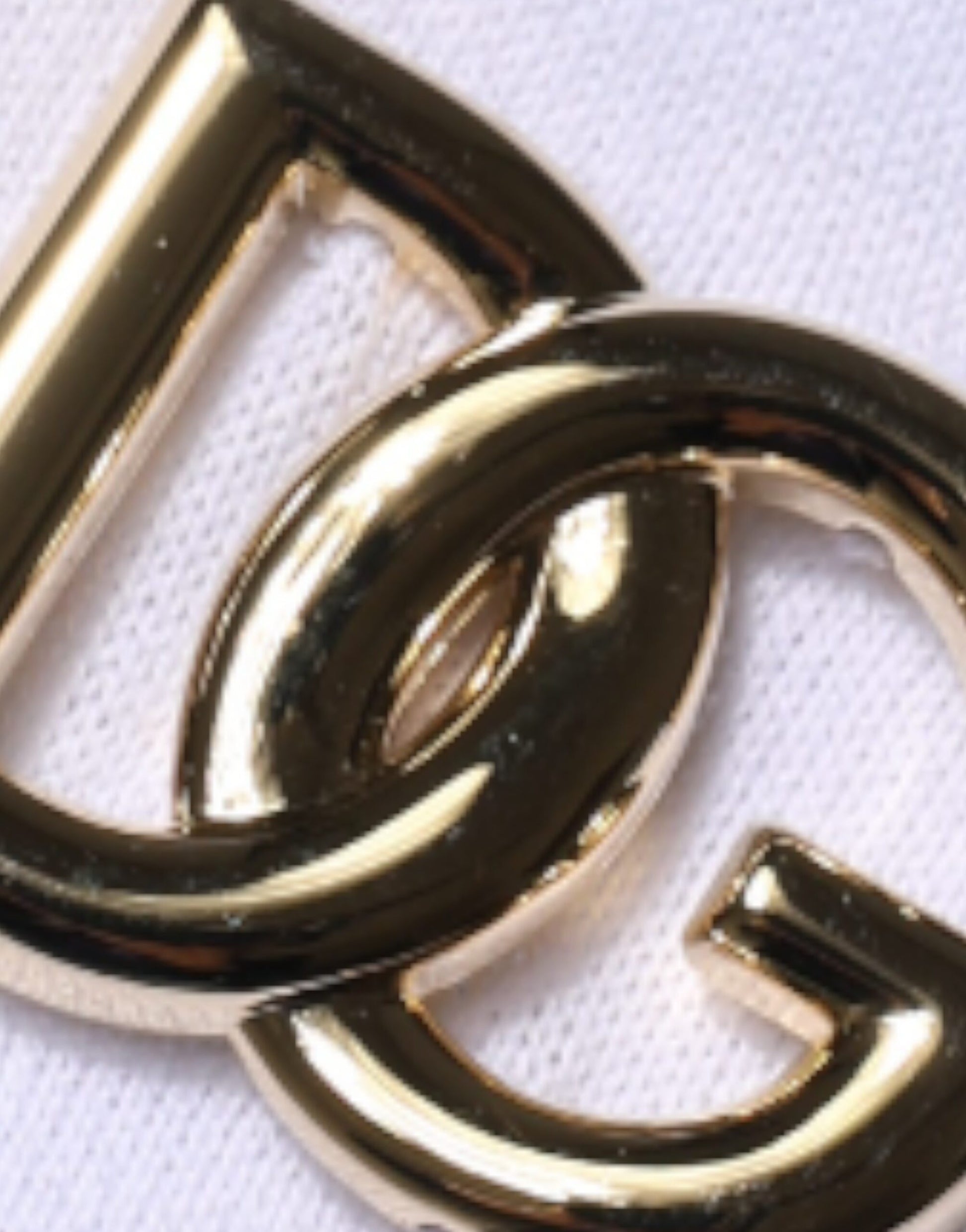Gold lettered logo on a white background