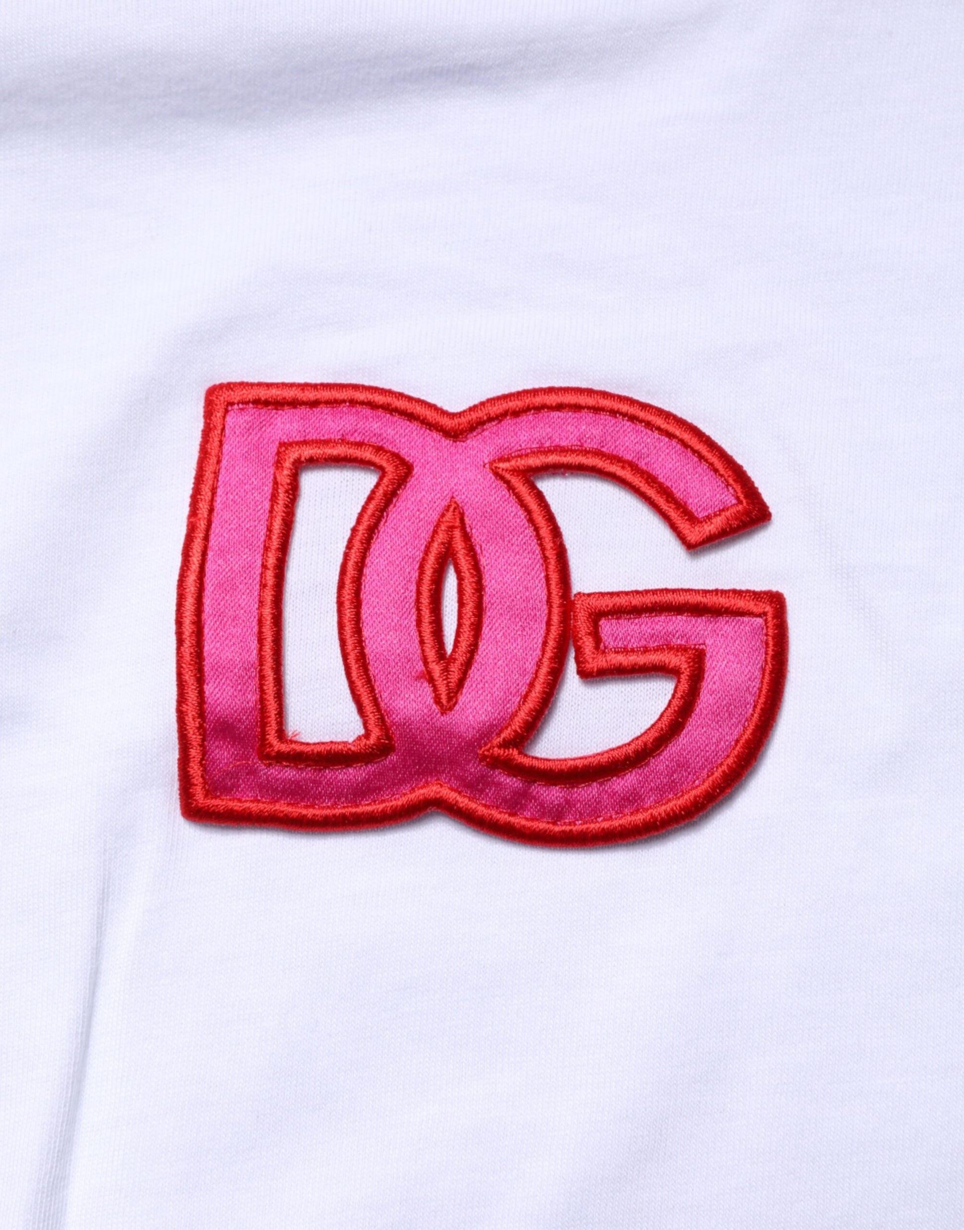 Pink embroidered logo on white fabric