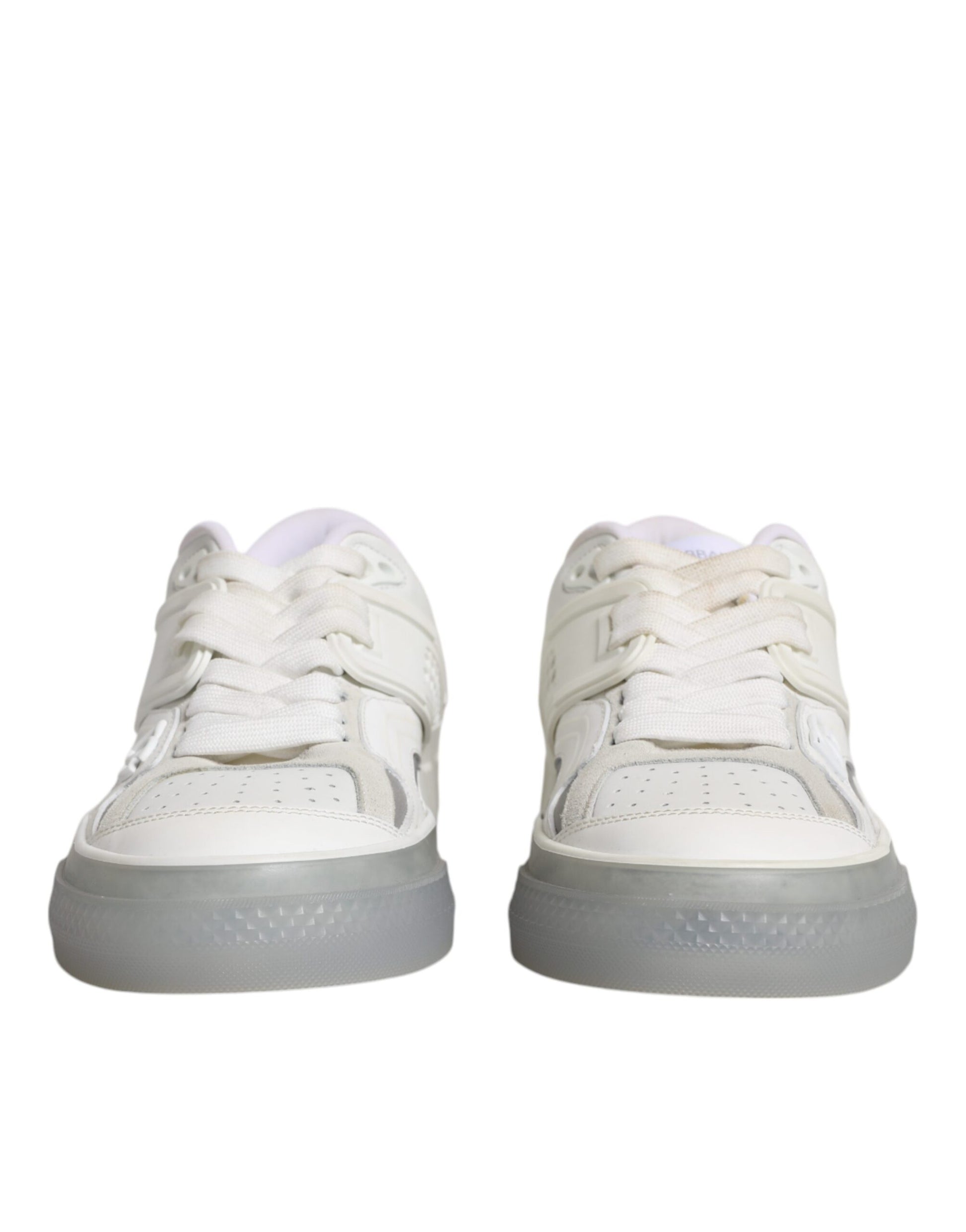 Pair of white sneakers with laces and a rubber sole