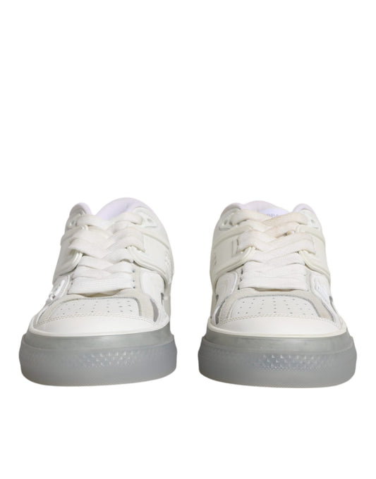 Pair of white sneakers with laces and a rubber sole