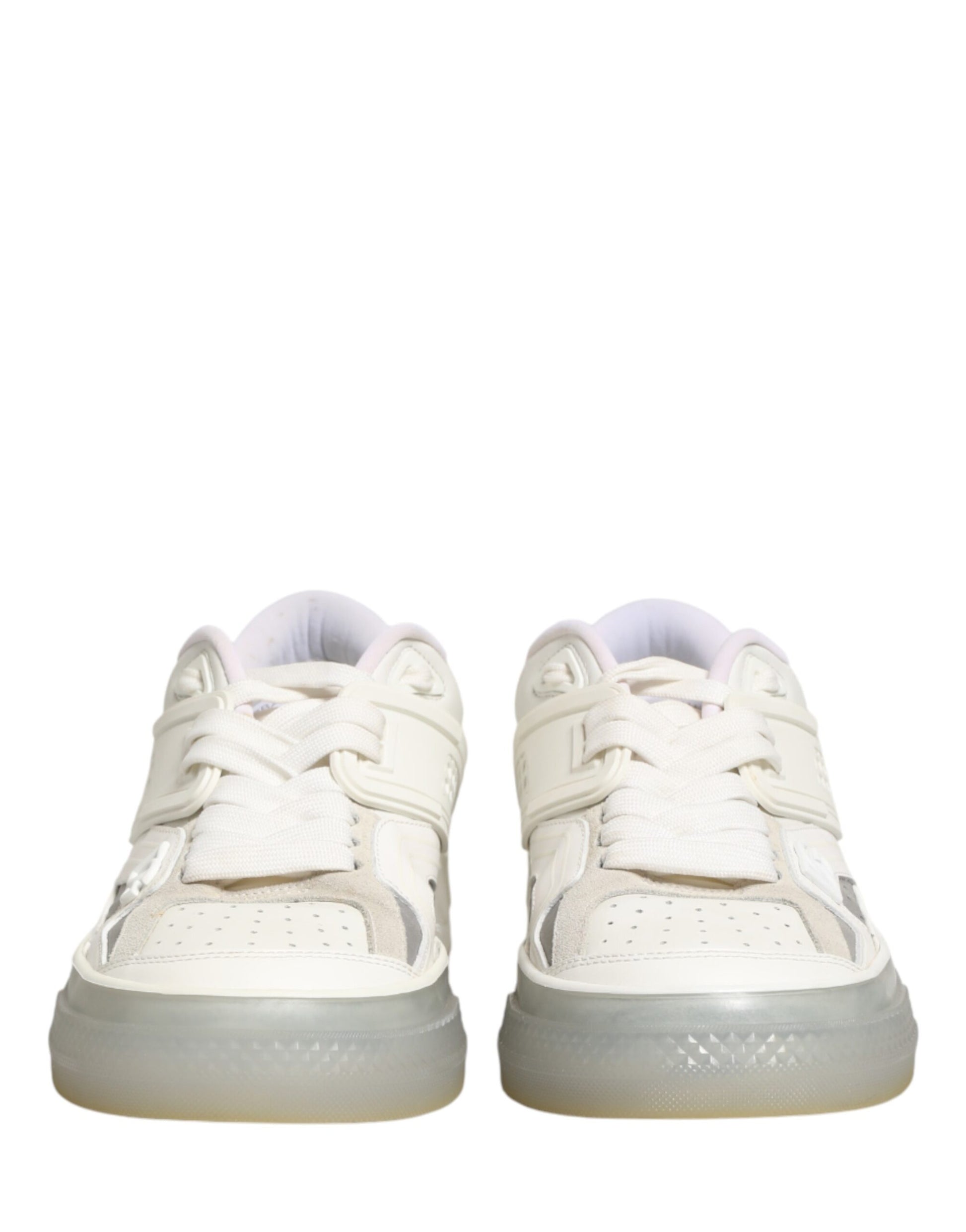 Pair of white sneakers with pink laces