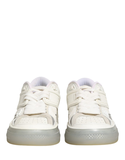 Pair of white sneakers with pink laces