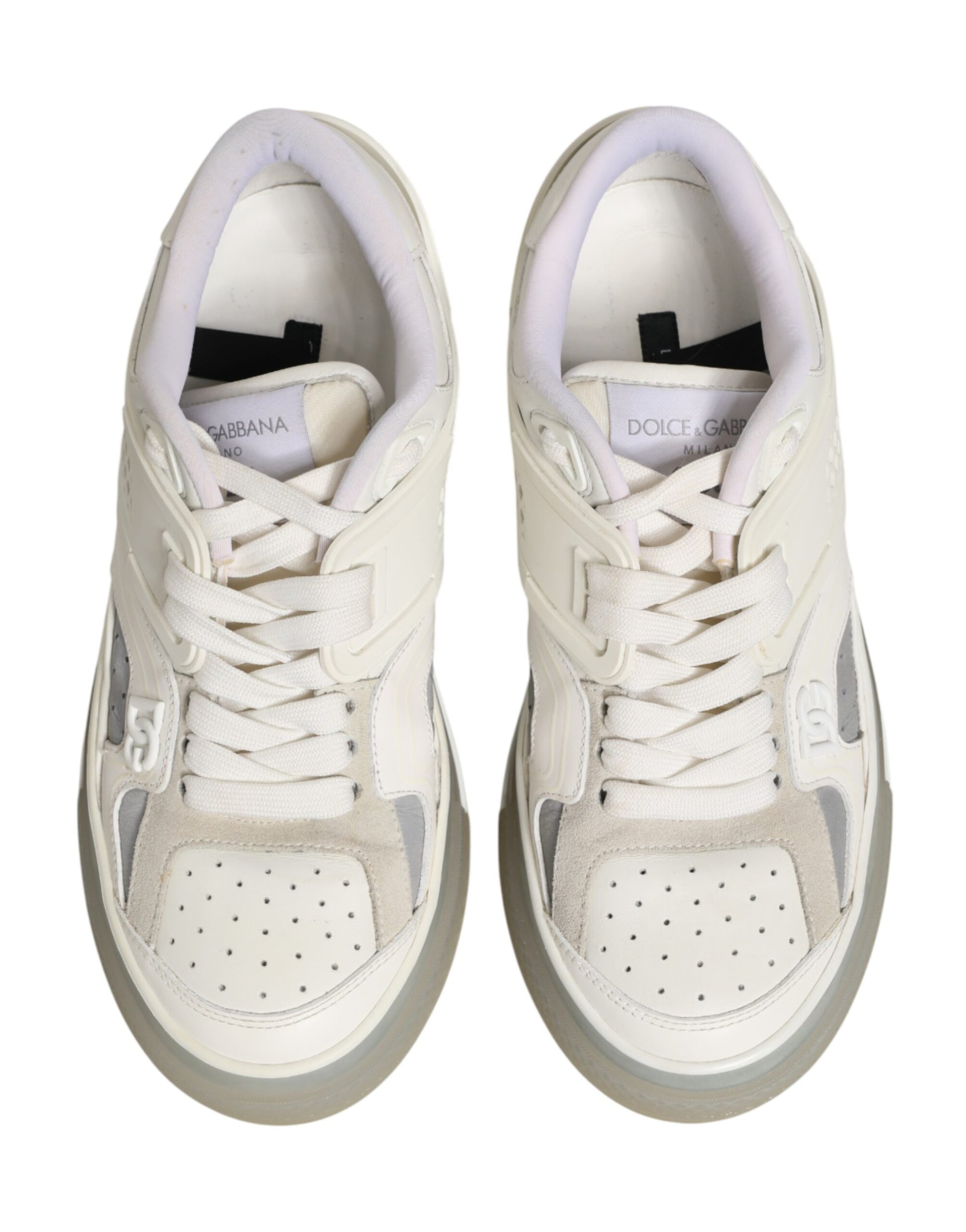 Pair of white sneakers with pink laces