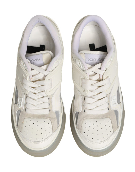 Pair of white sneakers with pink laces