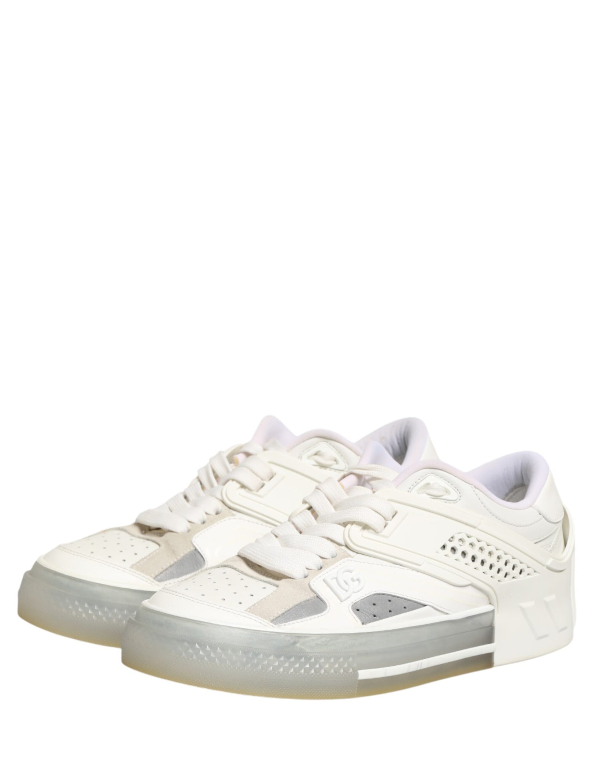 Pair of white sneakers with pink accents