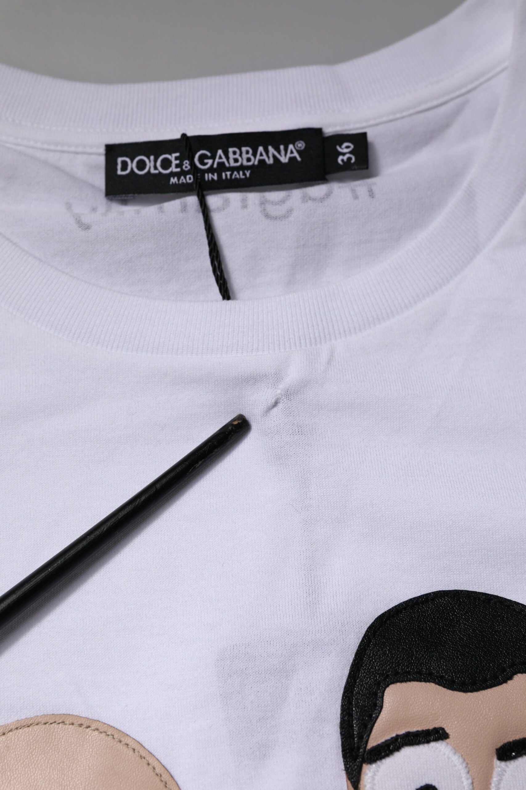 White t-shirt with graphic design on front