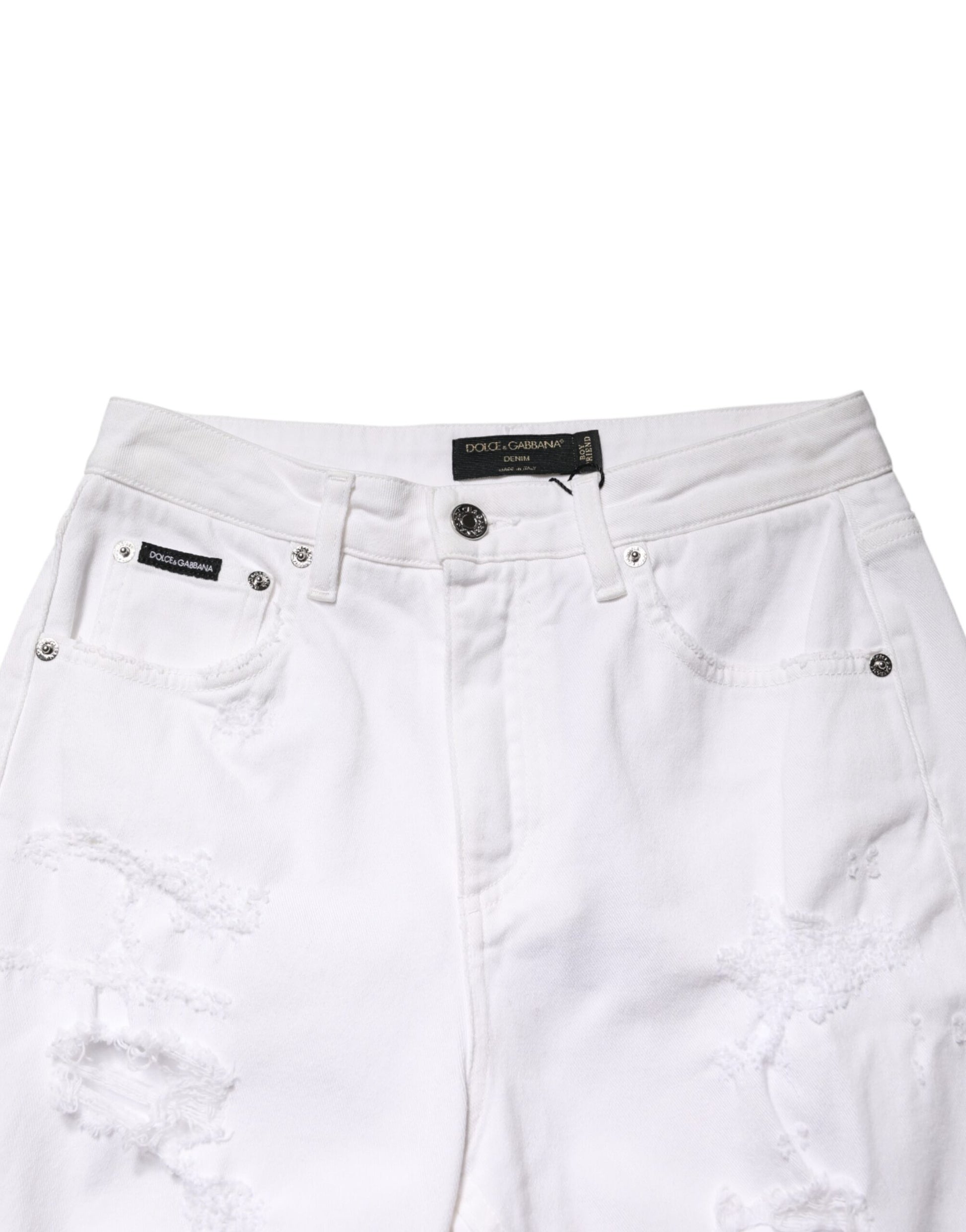 White distressed denim shorts with rips and tears