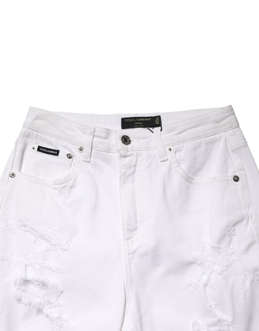 White distressed denim shorts with rips and tears