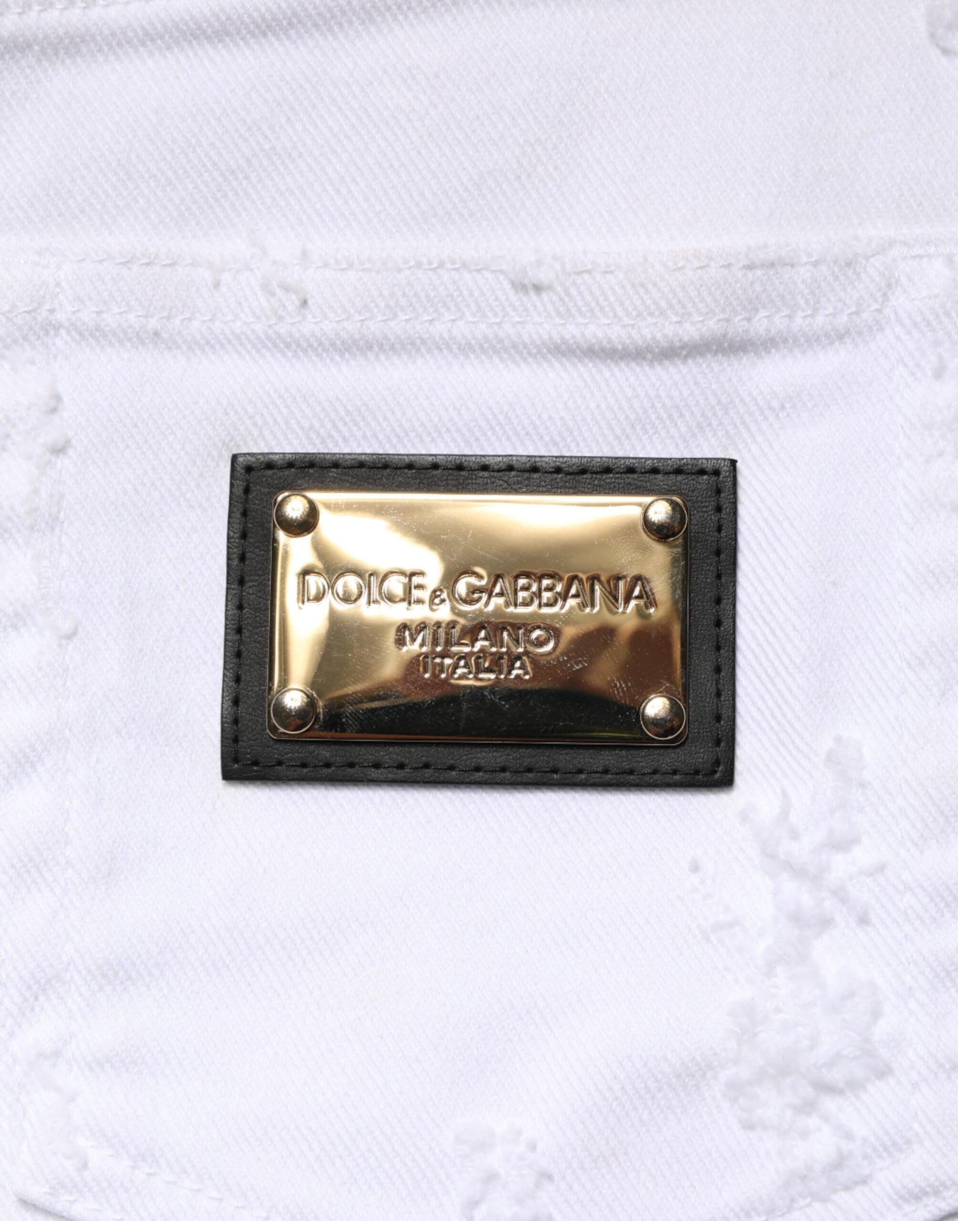 Gold brand logo on white fabric