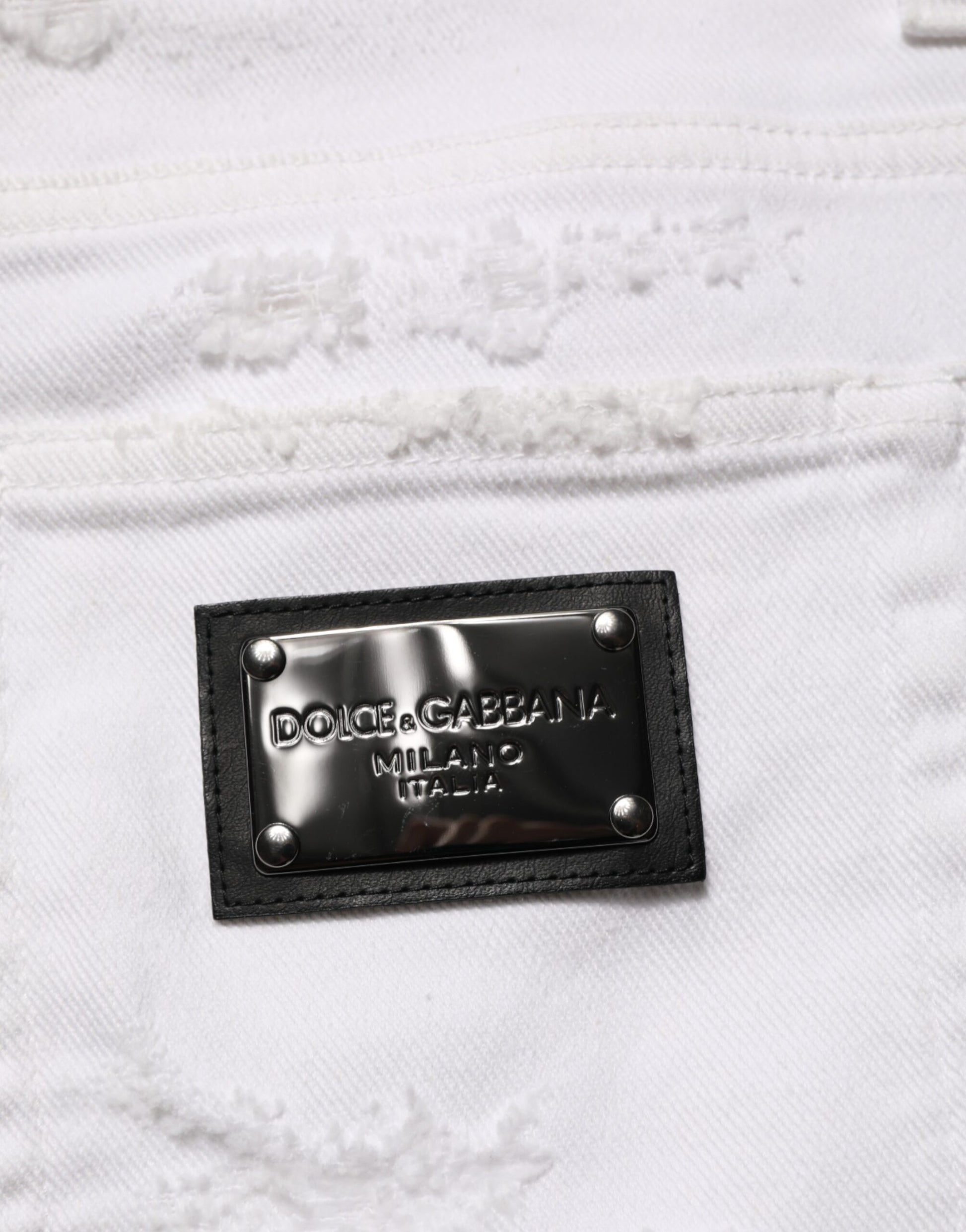 Black leather label on white fabric