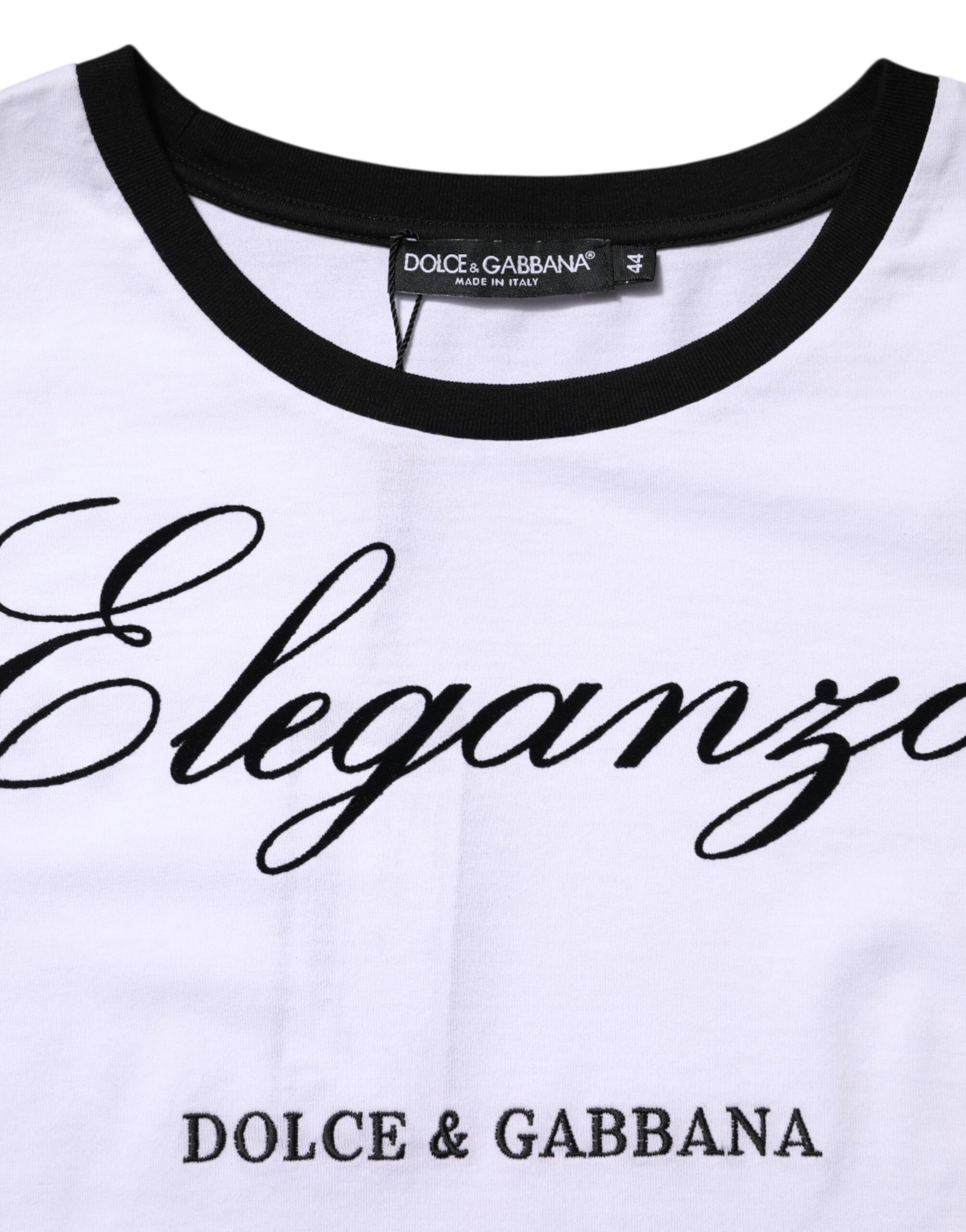 White t-shirt with black collar and sleeves featuring brand names in cursive script