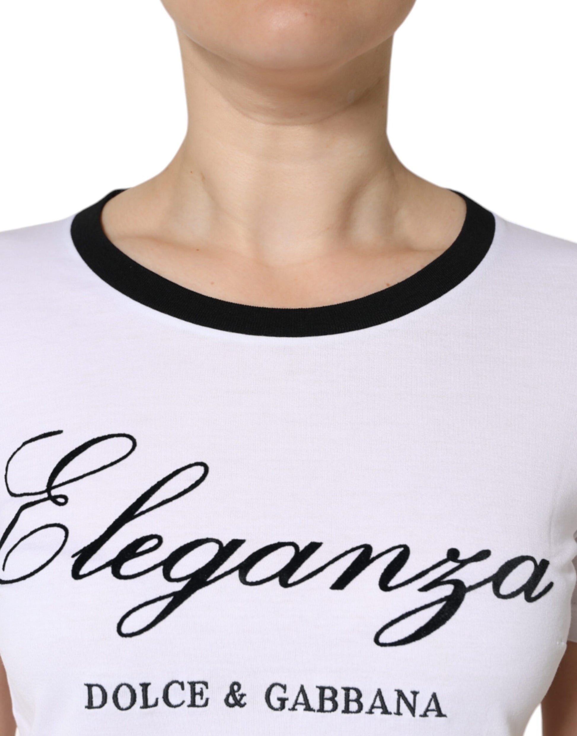 White t-shirt with black trim featuring "Eleganza Dolce & Gabbana" in cursive script