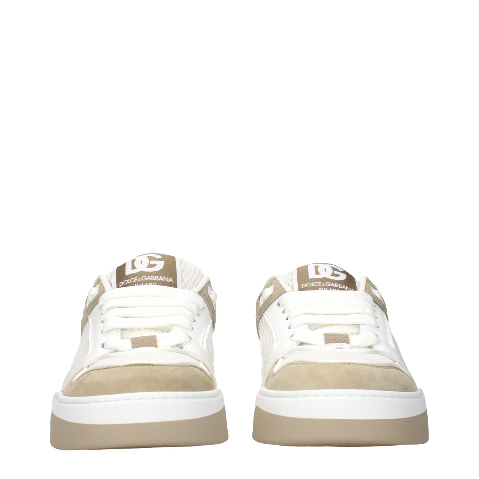 Pair of white sneakers with tan soles, featuring a logo on the side and laces