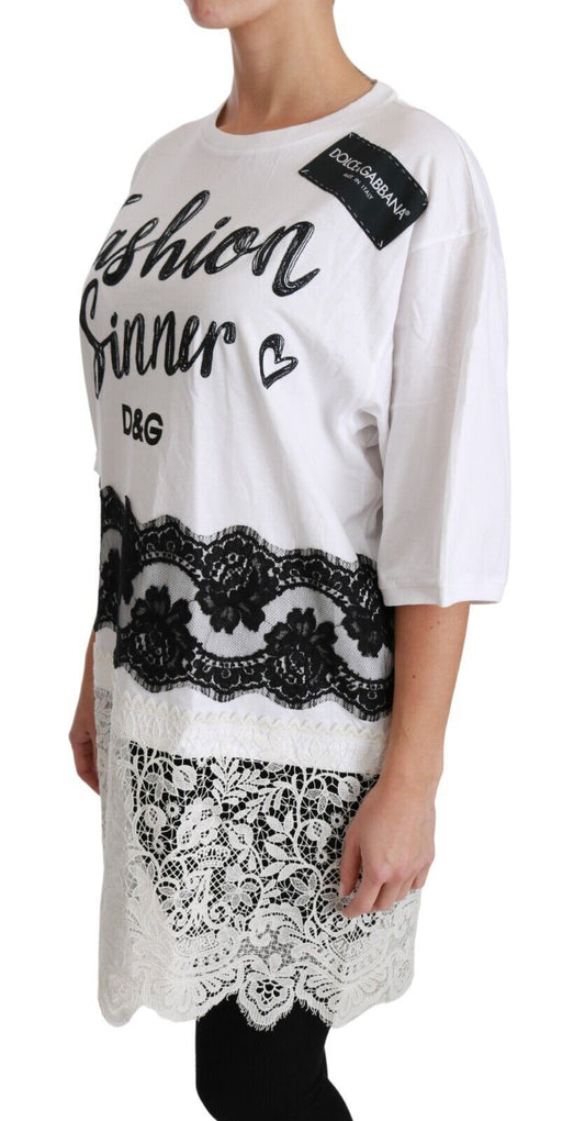 White long sleeve shirt with black lettering and lace pattern on skirt