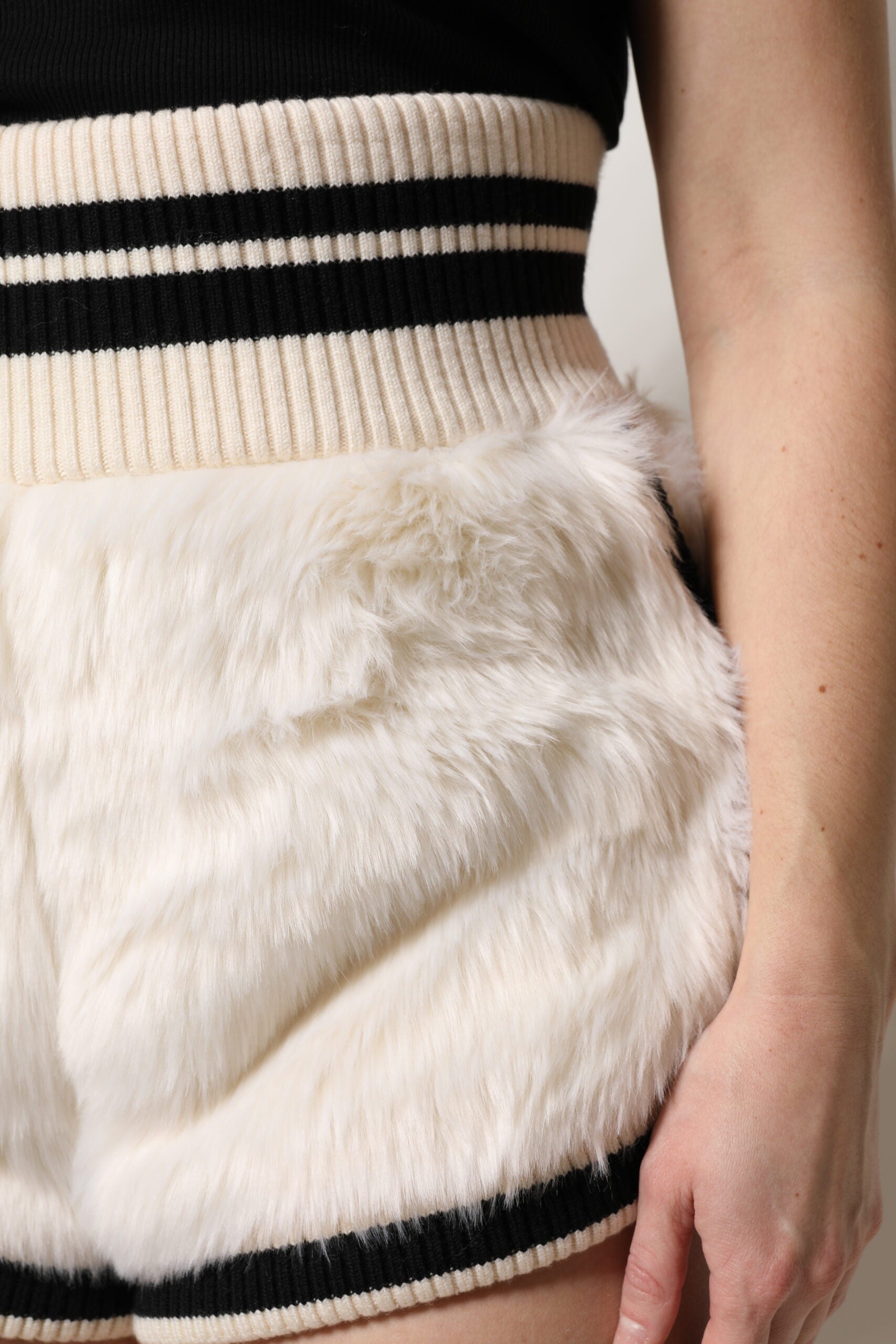 Furry vest on woman's waist
