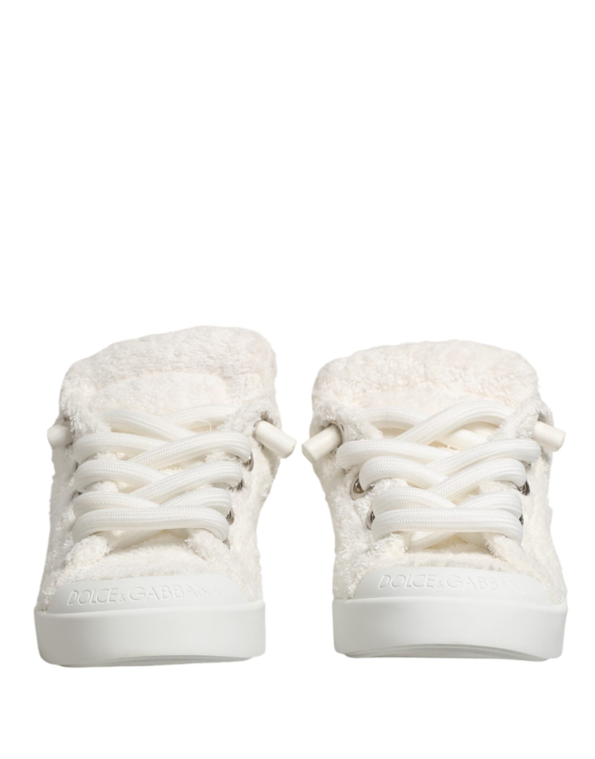 Pair of white faux shearling low top sneakers with laces