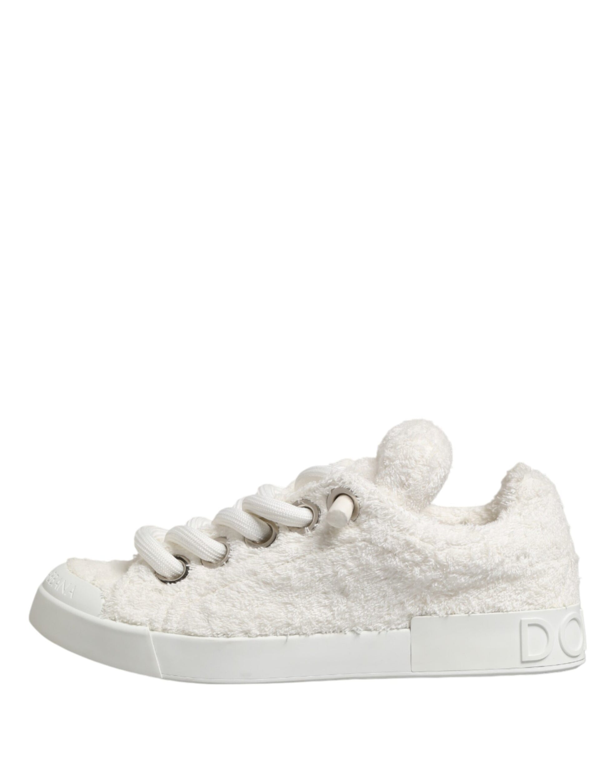 A pair of white faux shearling low top sneakers with silver laces