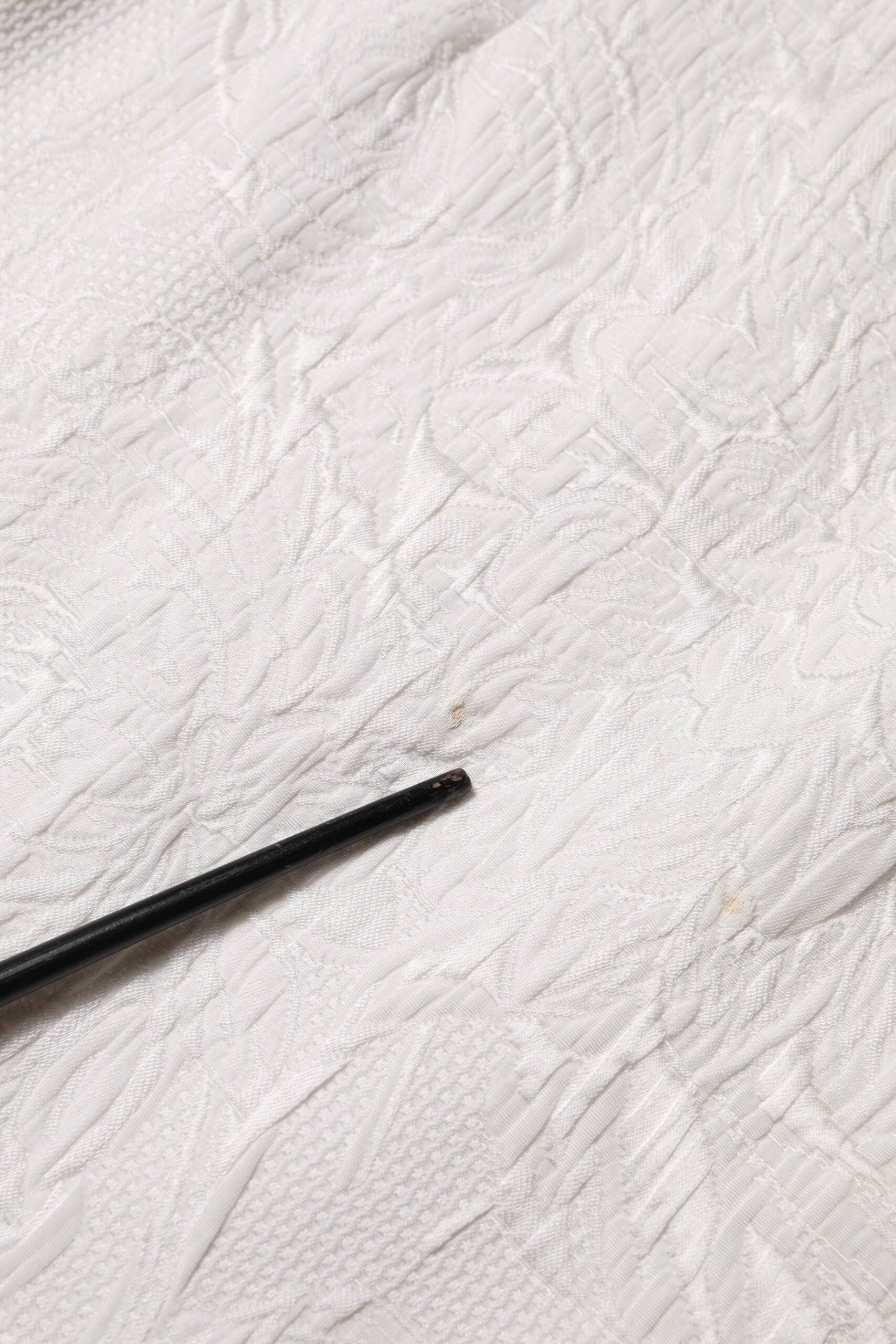 Black straw on white paper towel