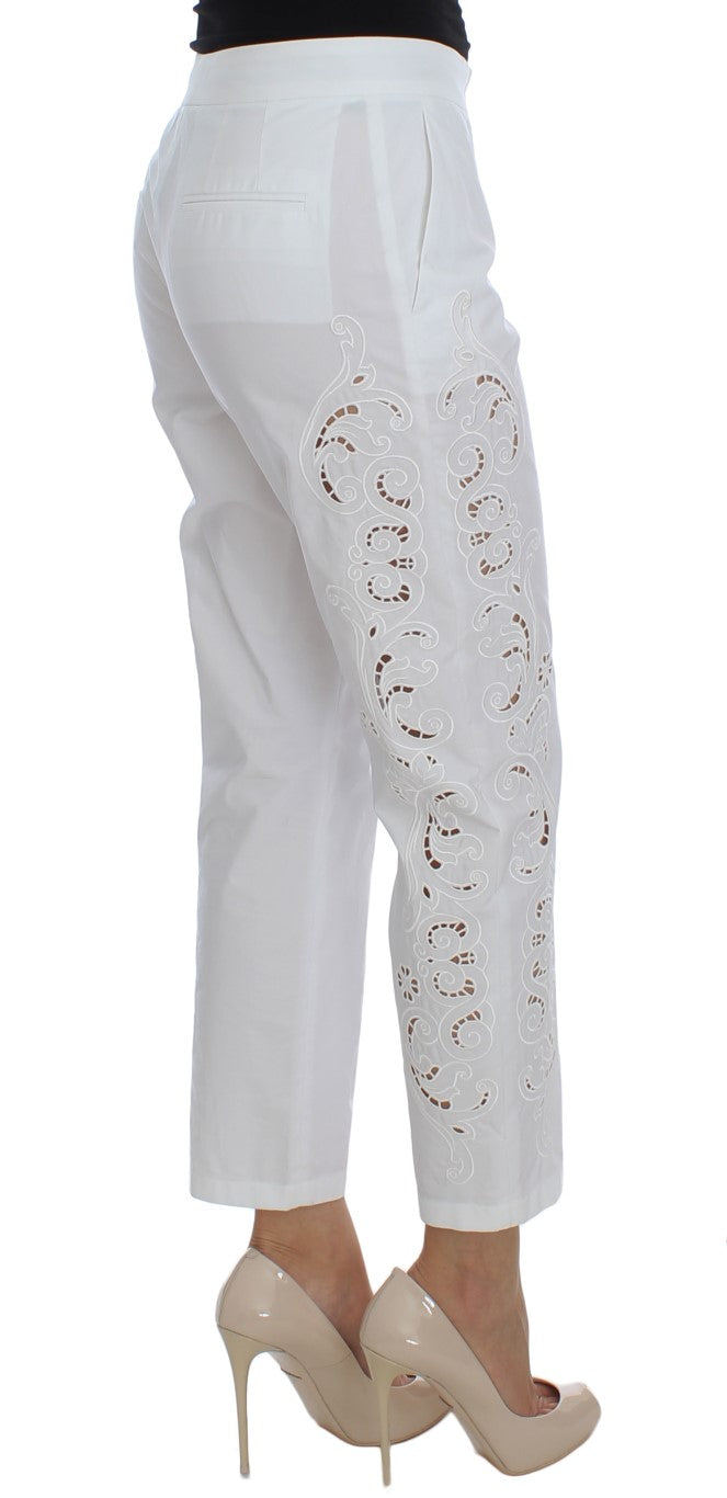 White pants with embroidered design