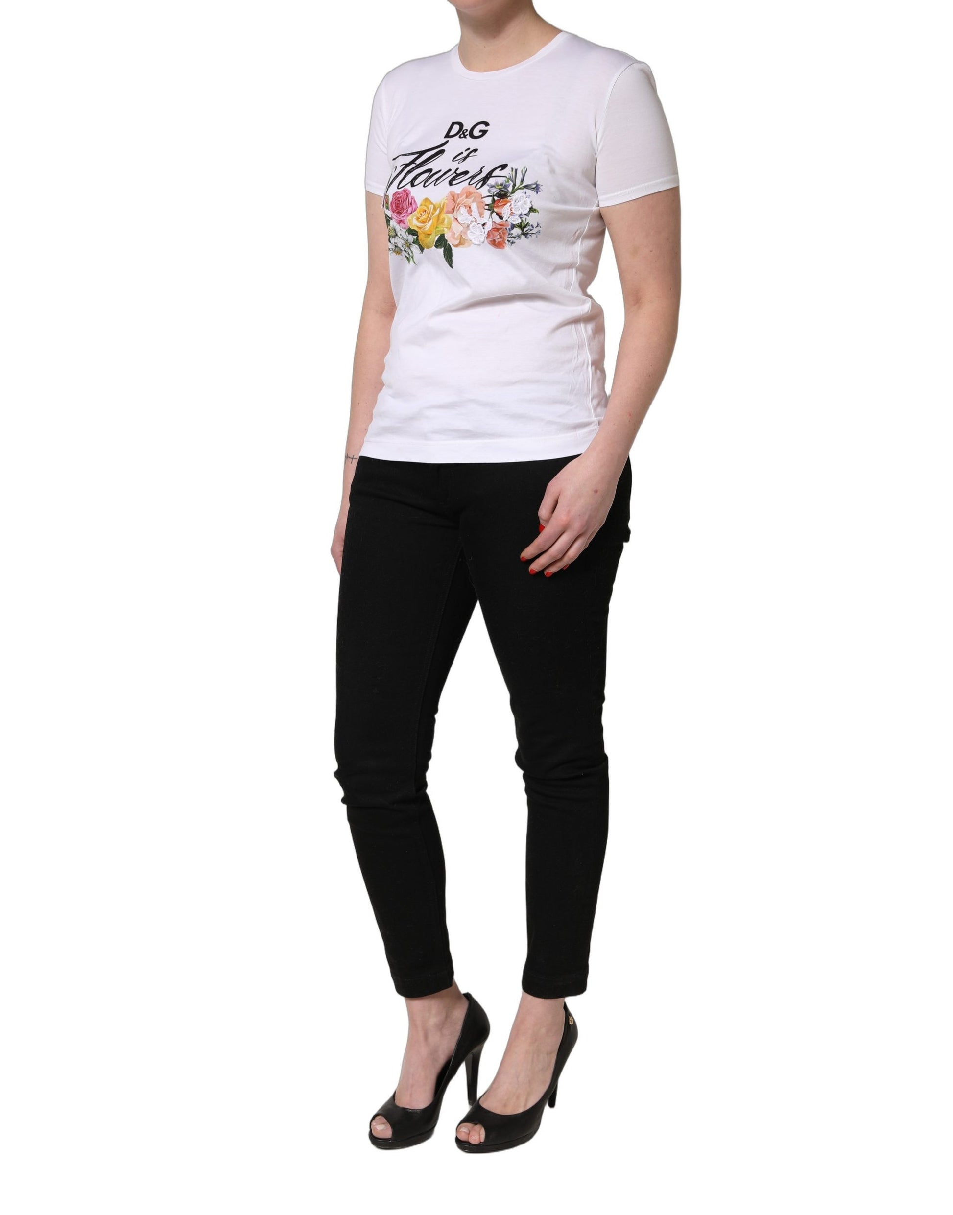 A woman wearing a white t-shirt with floral graphic