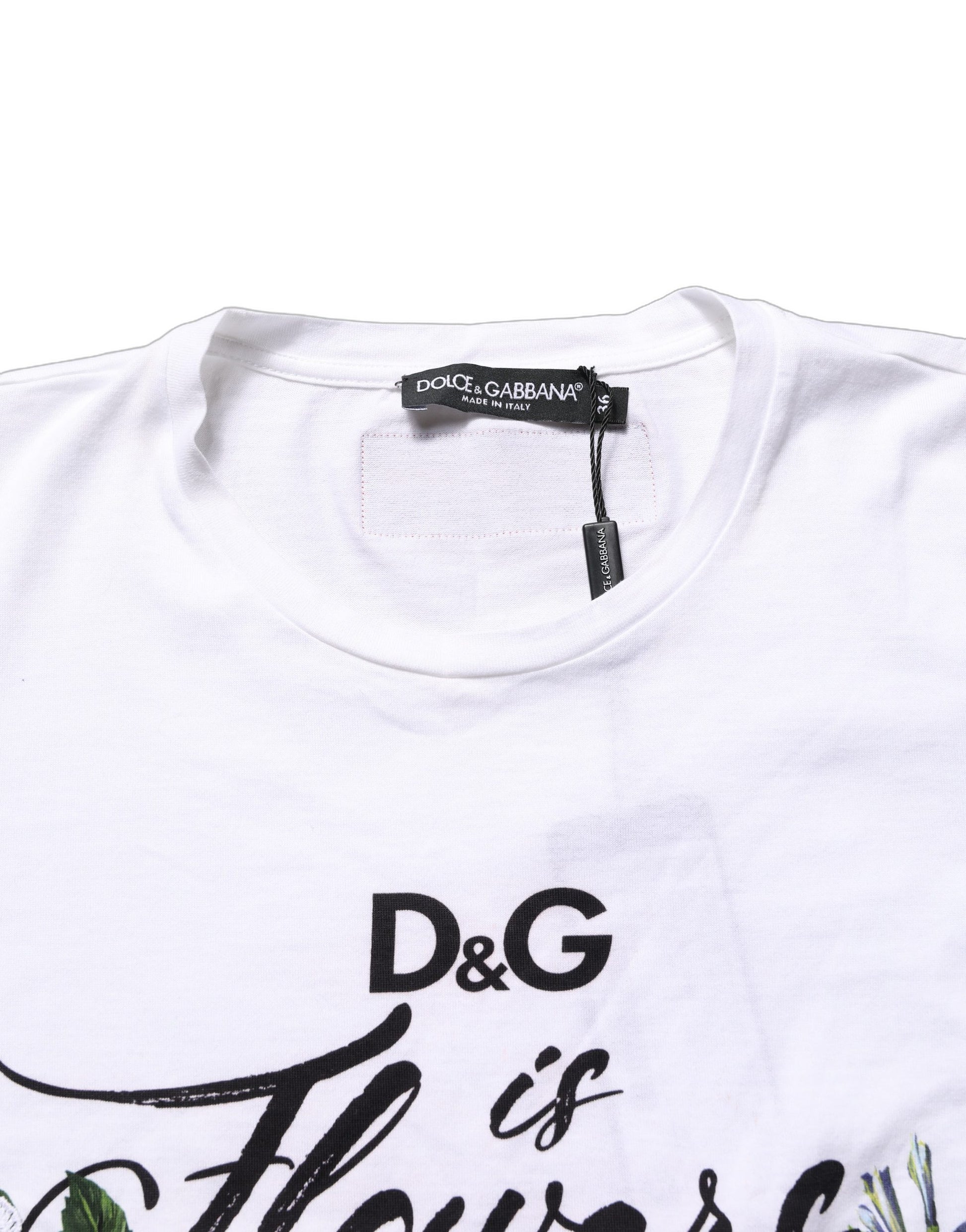 White t-shirt with floral graphic and text