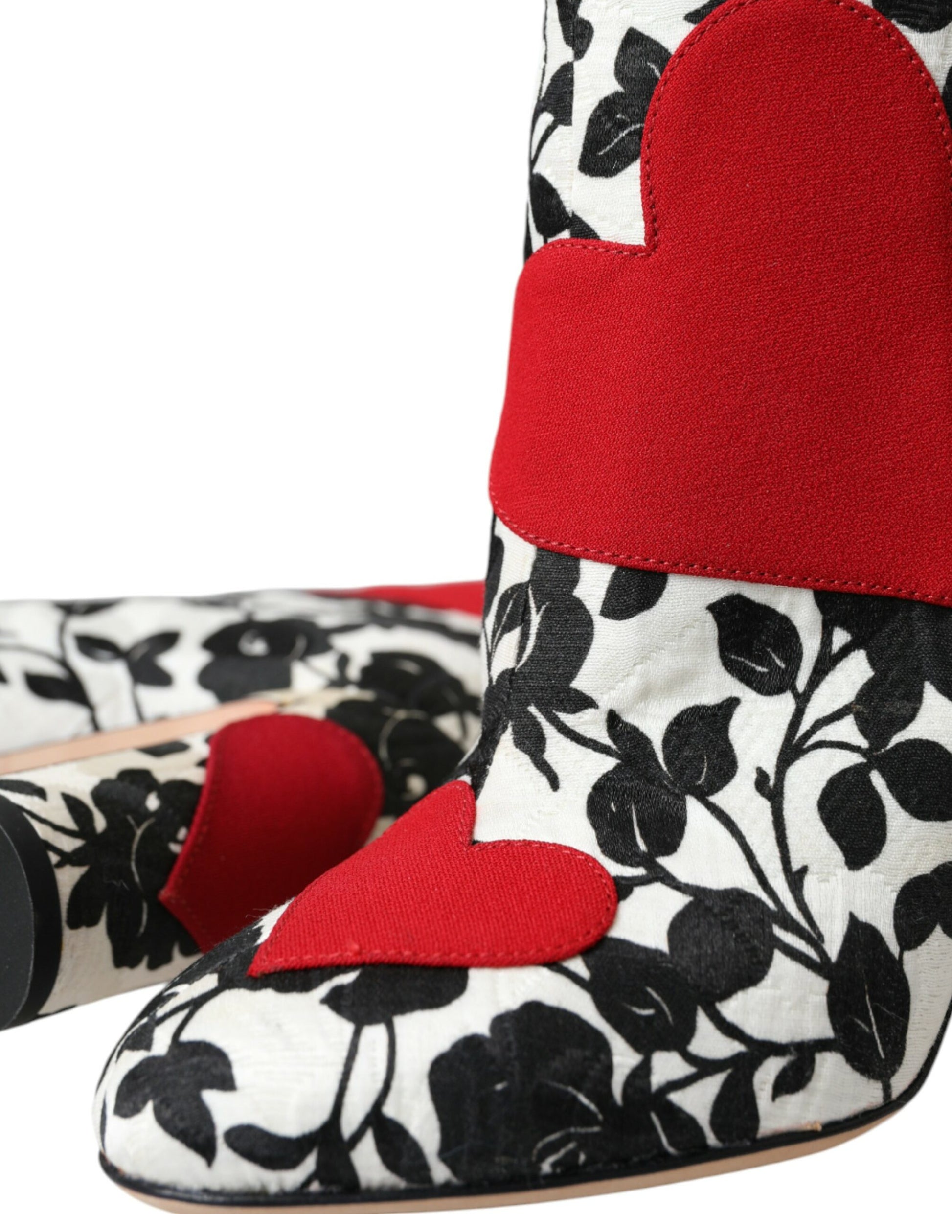 Pair of women's boots with floral pattern and red heart accents