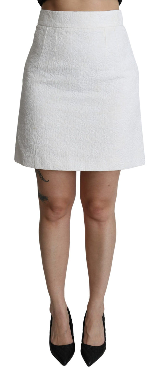 White skirt with black waistband, worn by a person standing against a grey background