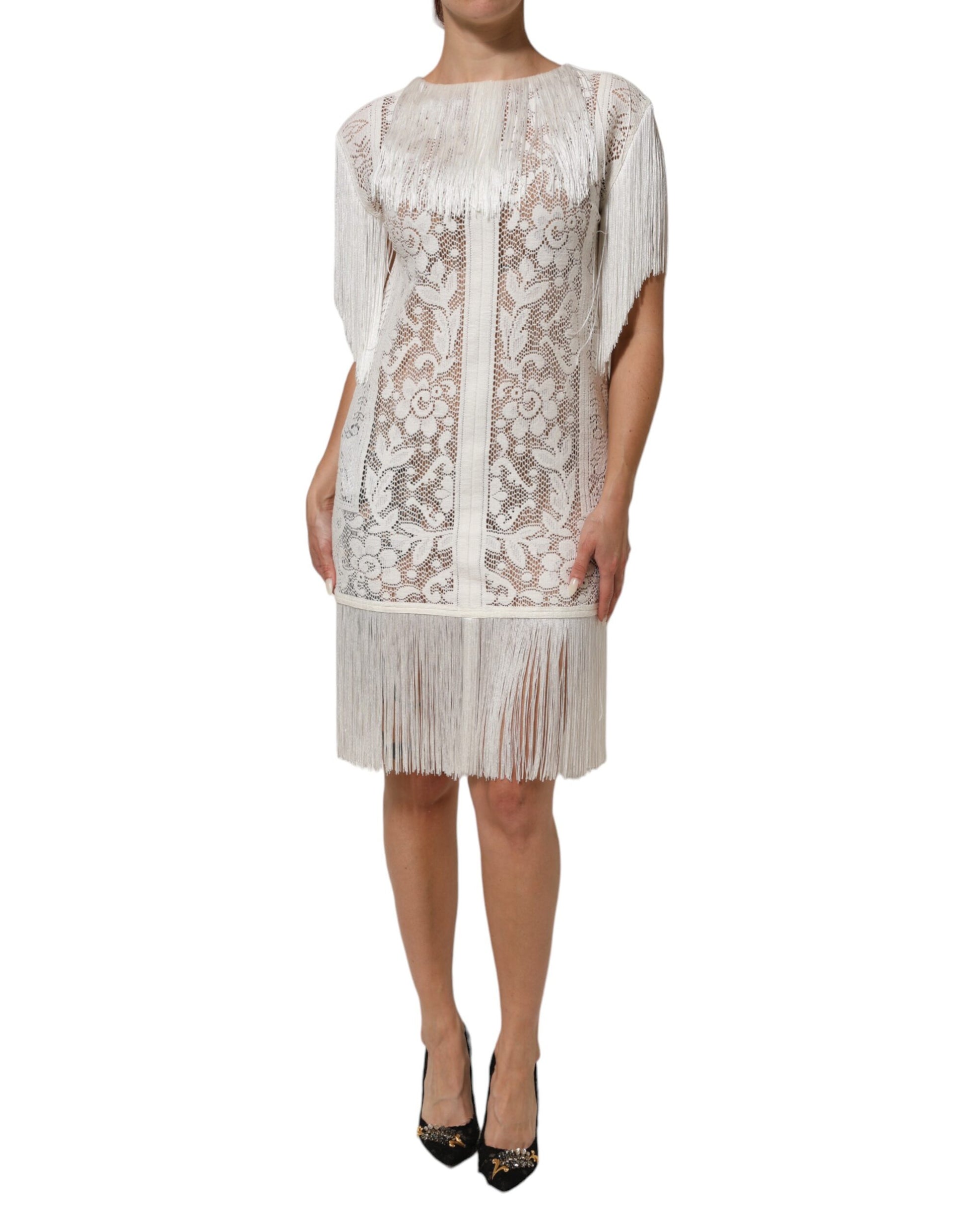 A white floral lace dress with fringe detailing, knee length