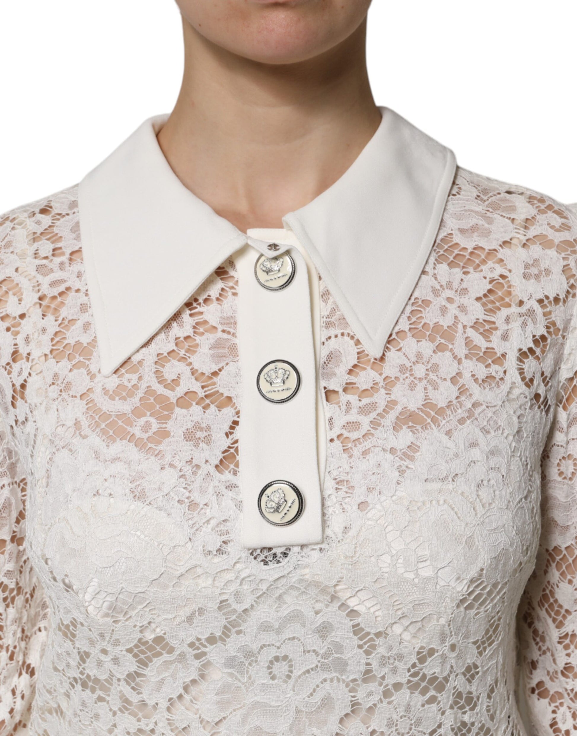 White lace dress with long sleeves and a V-neck collar