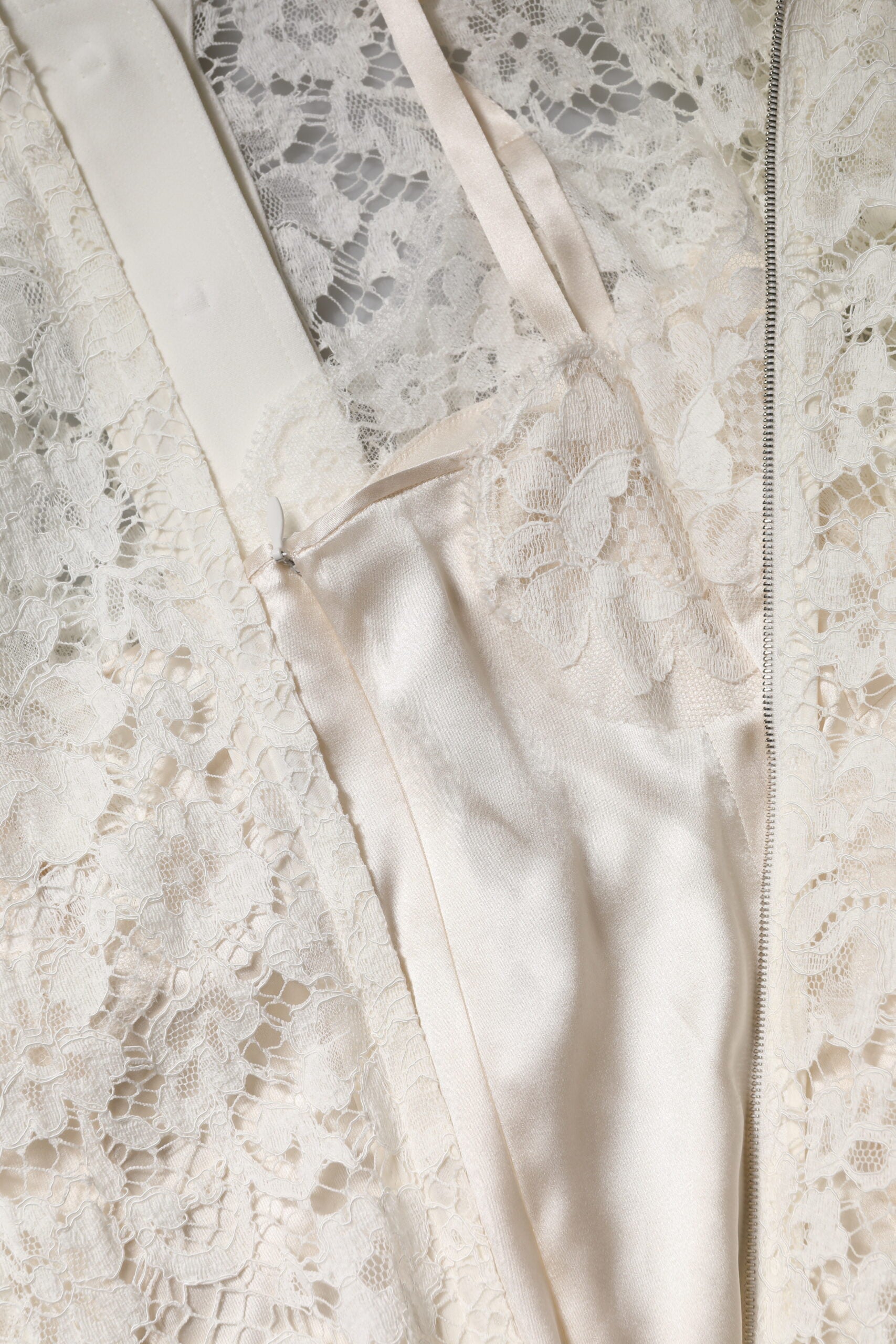 A white floral lace long sleeve dress with an A-line silhouette