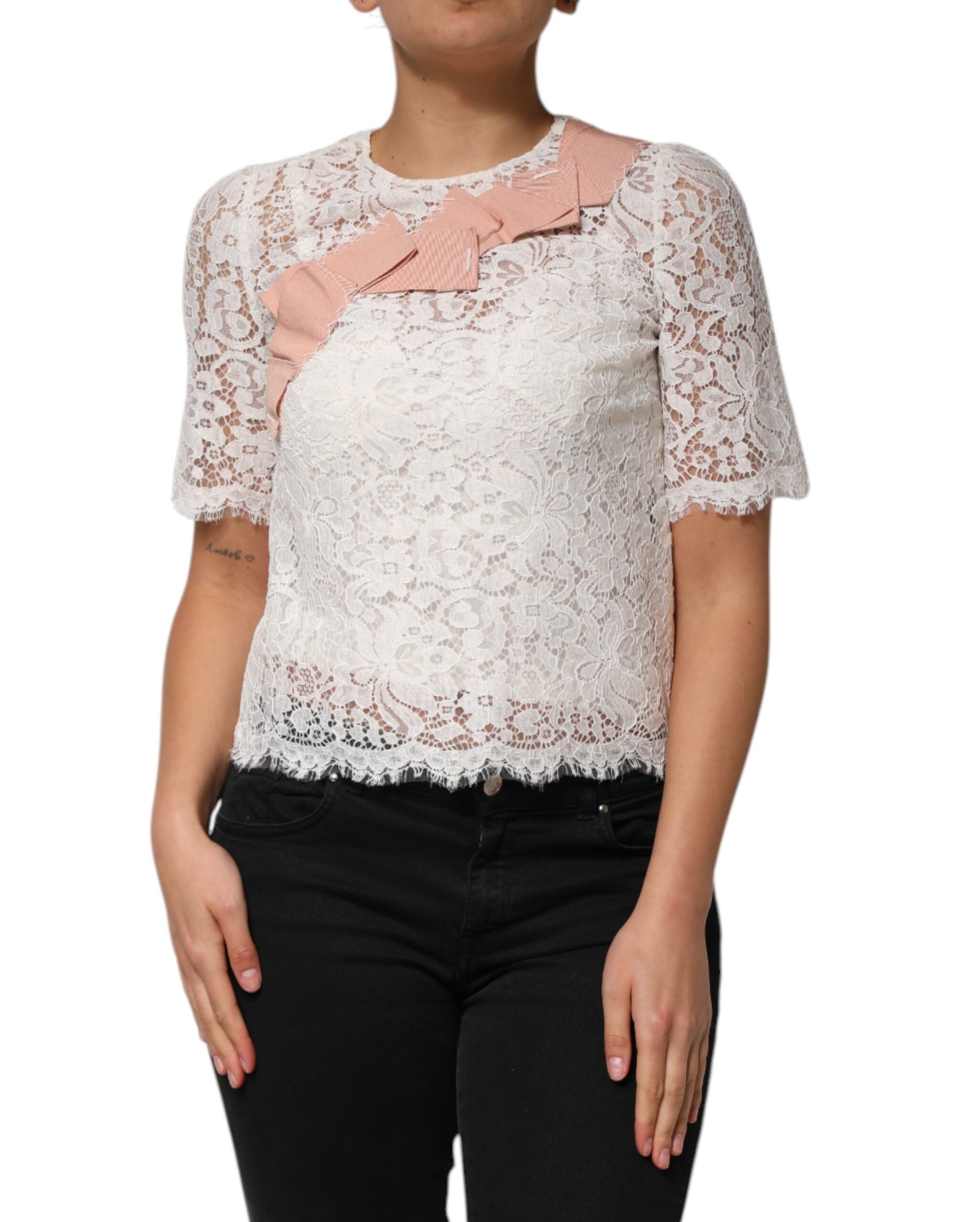 Woman wearing lace top with pink accents
