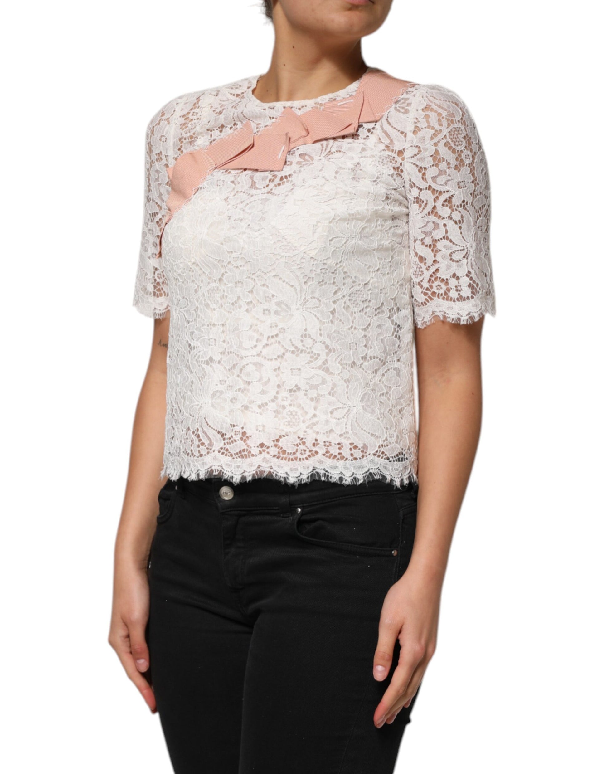 Woman wearing lace top with pink trim
