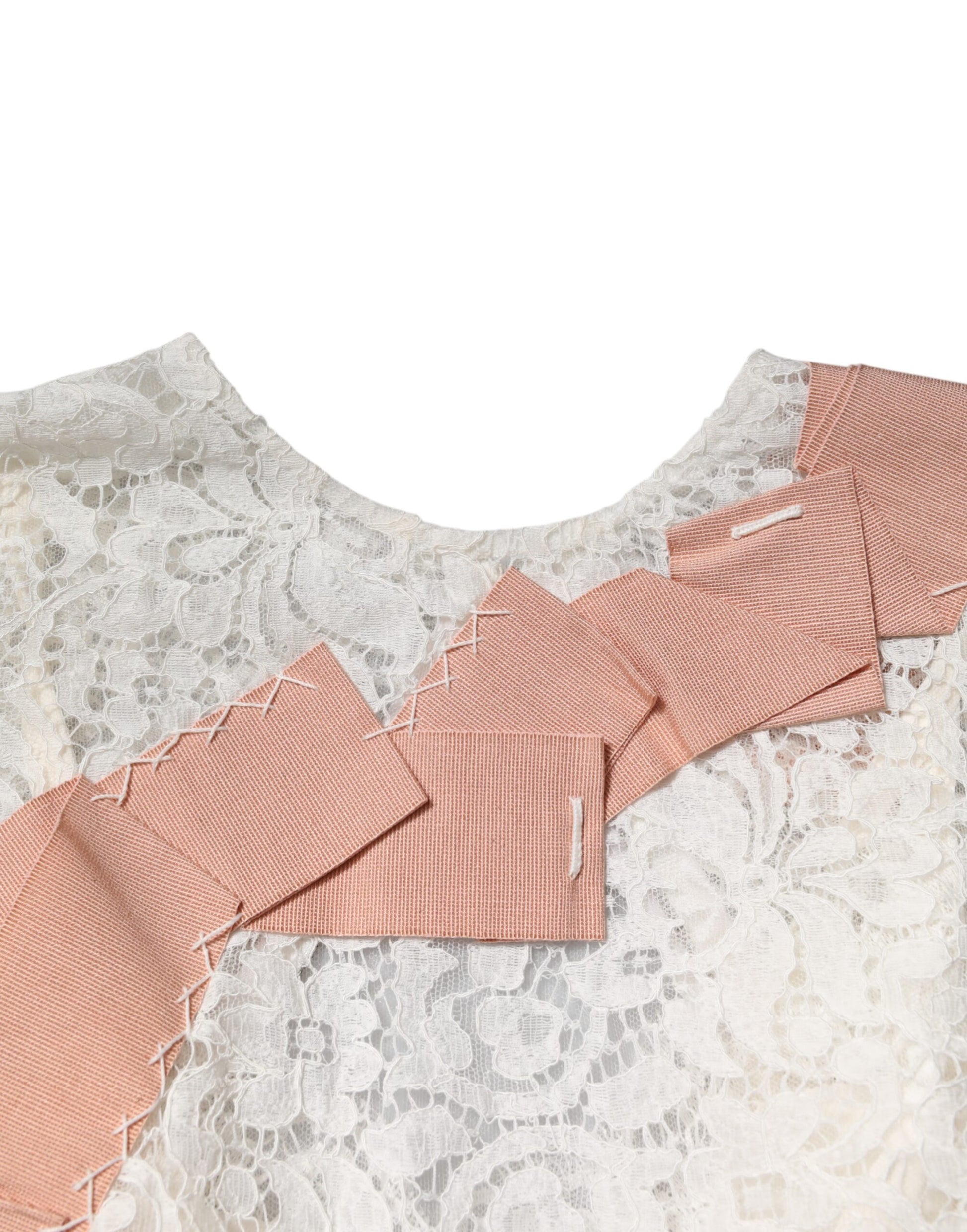 Textured lace garment with pink accents