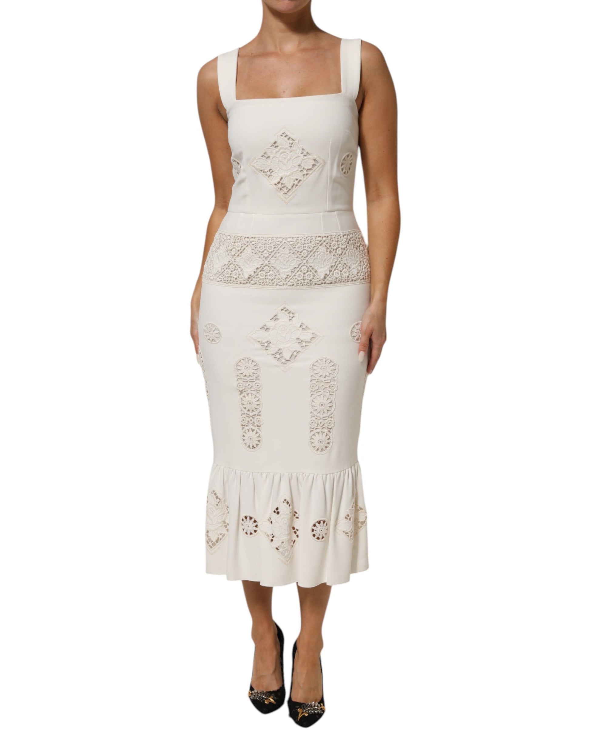 A white lace midi dress with floral pattern and sleeveless design