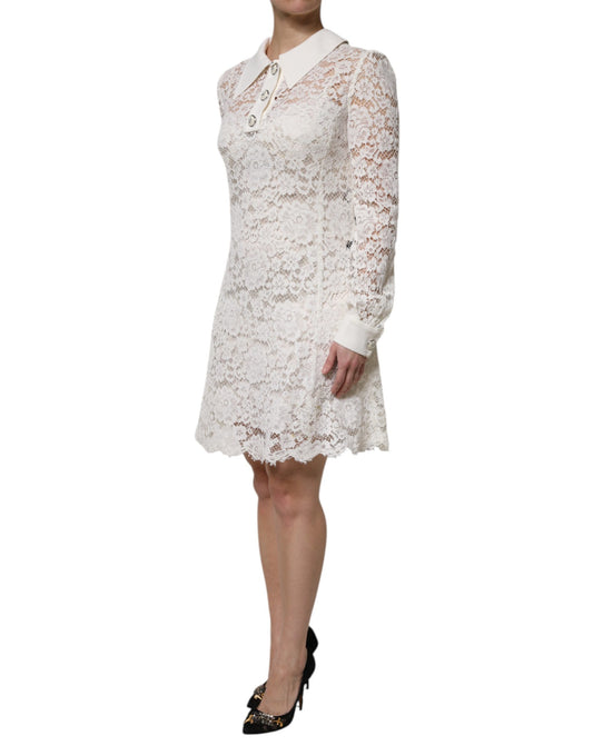A white lace dress with a collar and short sleeves, featuring floral patterns