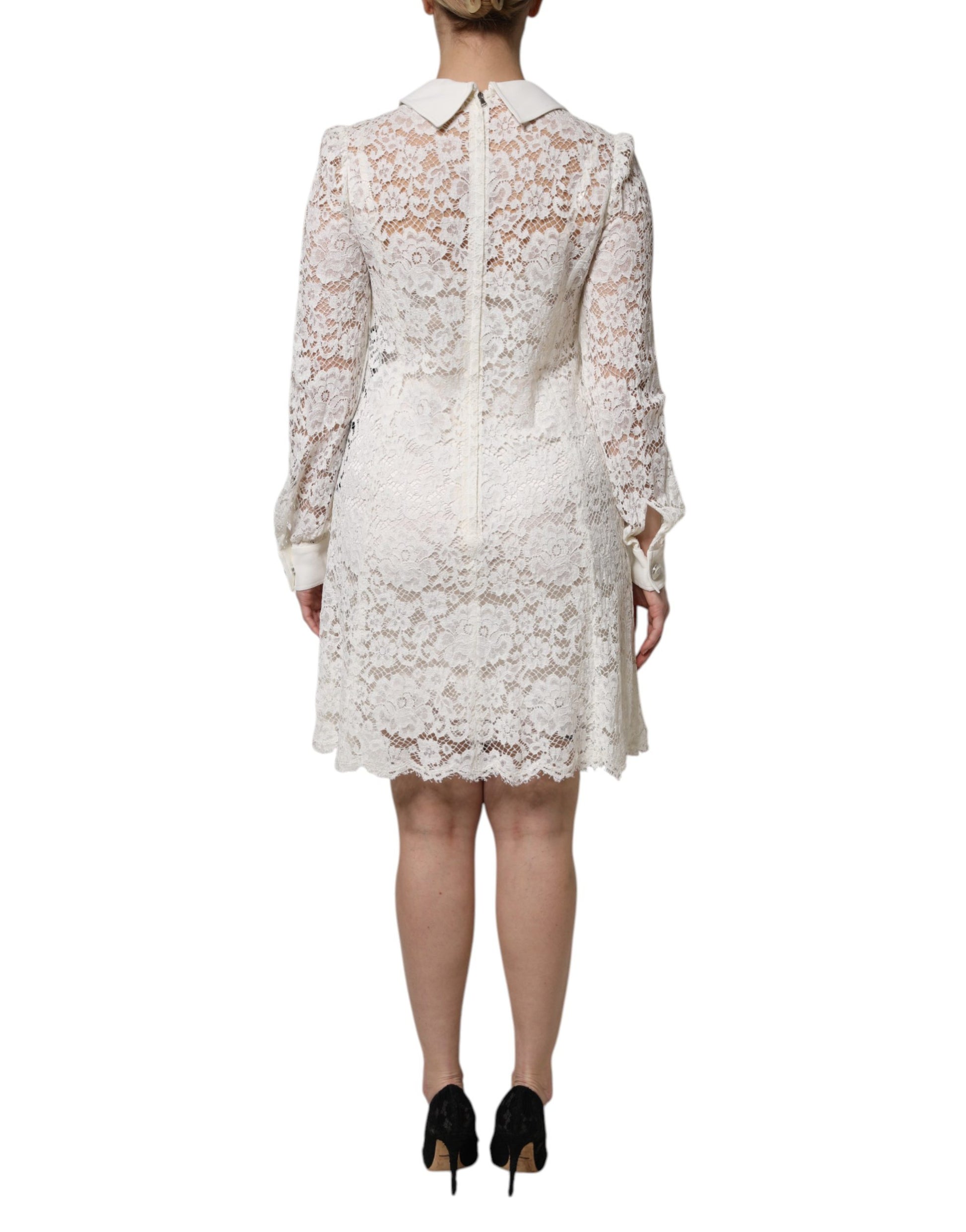 A white lace dress with floral pattern and collar, made of viscose