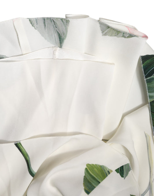 A white floral midi dress with one shoulder, designed by Dolce & Gabbana