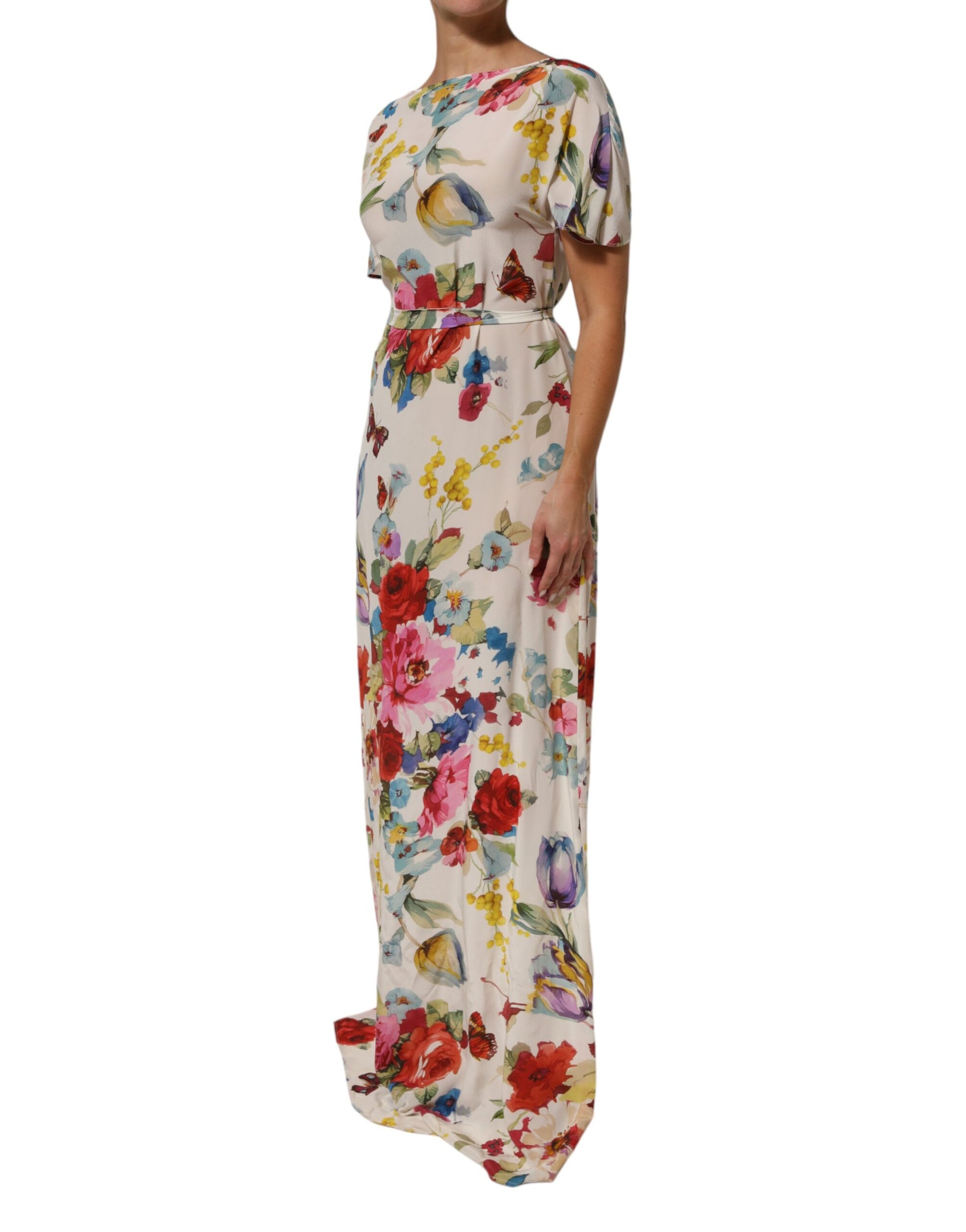 A long, floral print silk dress with a sheath style and belted waist