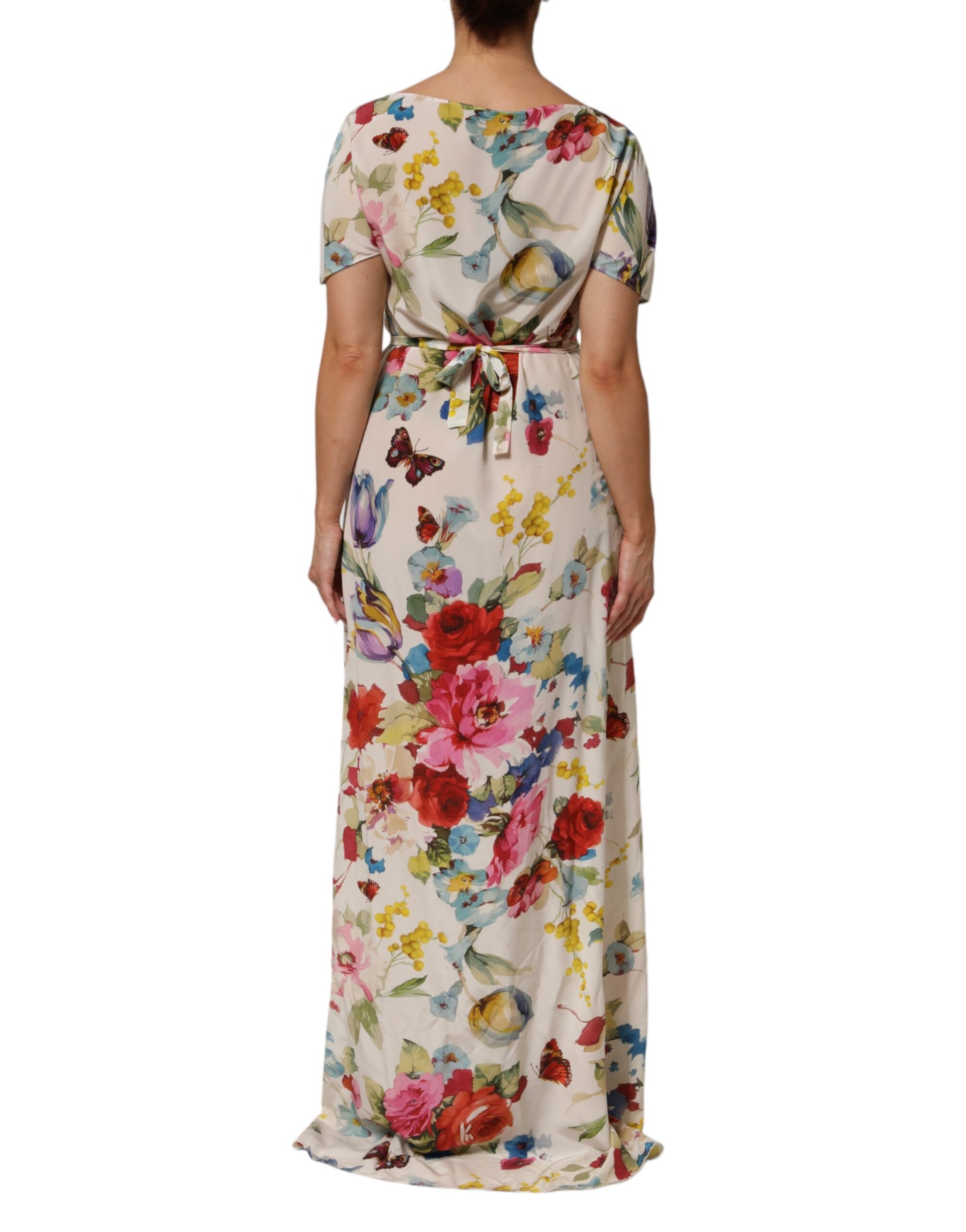 A long, white floral print silk sheath dress with a belted waist